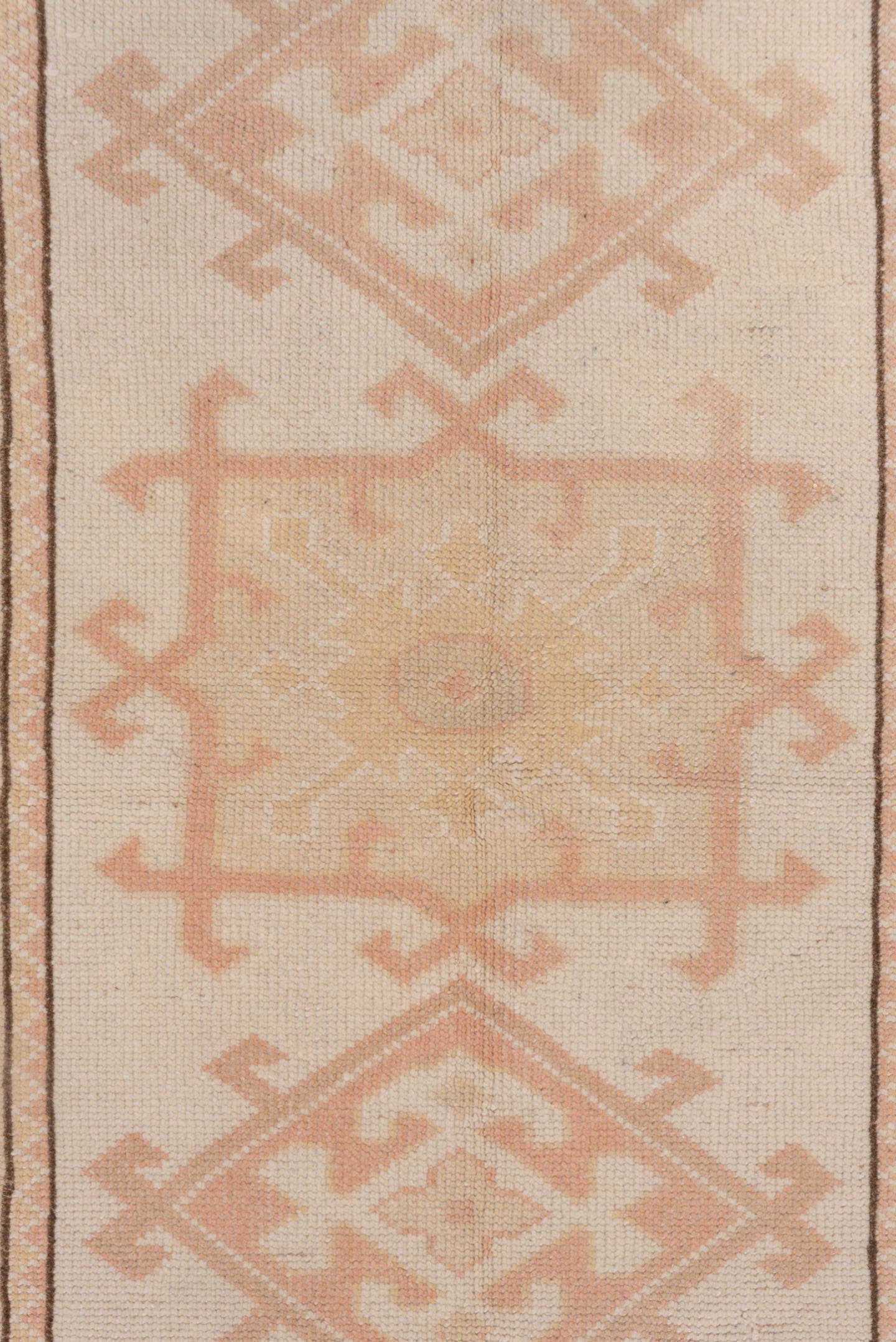 2' x 4' one-of-a-kind handmade vintage Oushak small size rug. Color palette: ivory, blush, peach, taupe, camel, pink