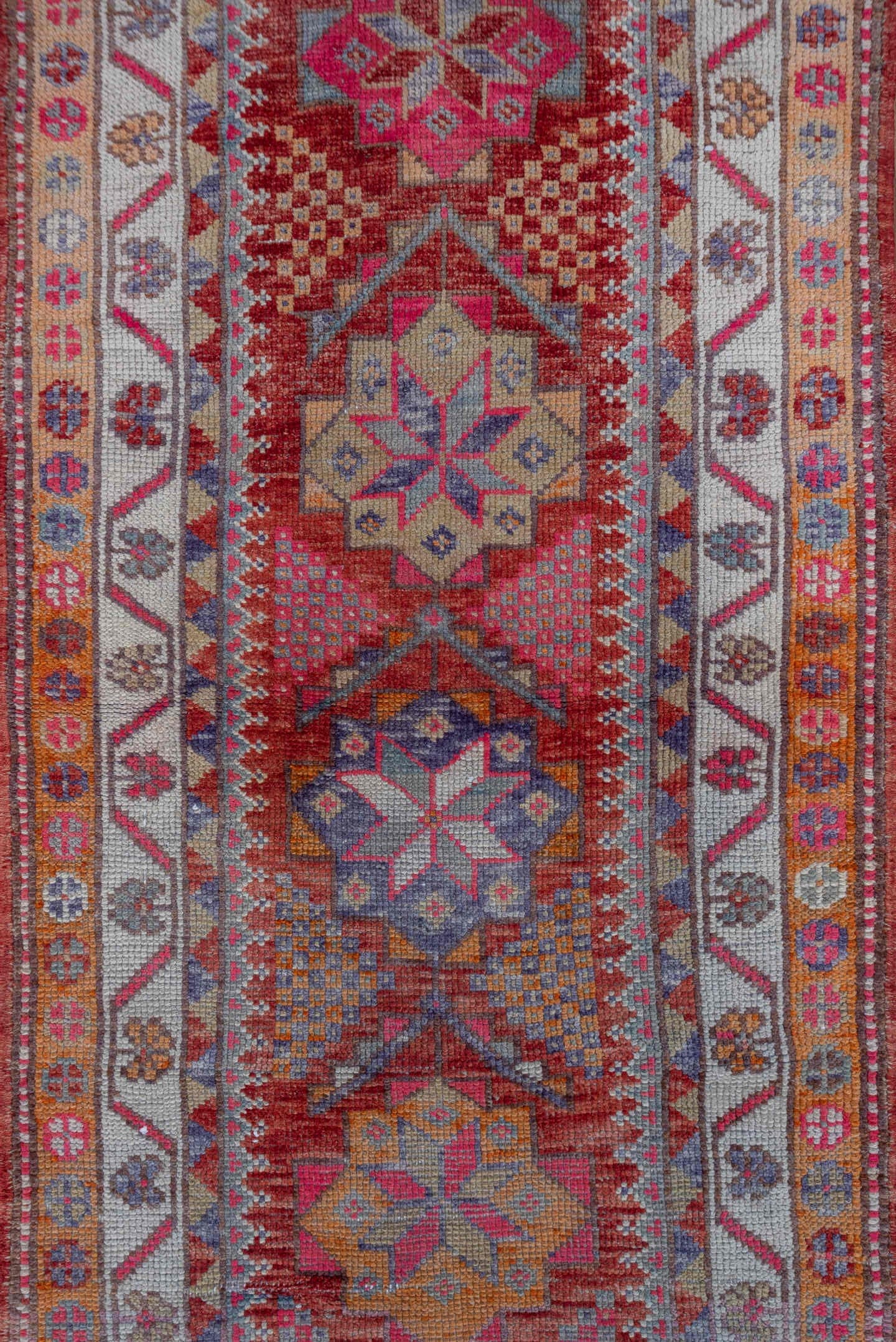 2' x 11' one-of-a-kind handmade vintage Oushak runner rug. Color palette: red, ivory, blue, pink, gold, rust, lavender