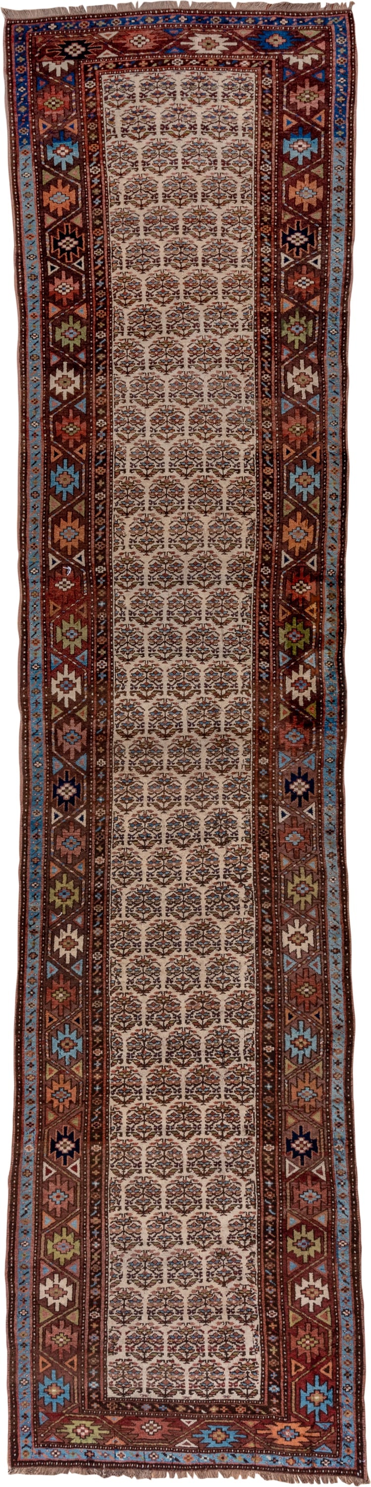 3' x 16' one-of-a-kind handmade vintage Kurd runner rug. Color palette: ivory, rust, brown, sky_blue, indigo, camel, navy