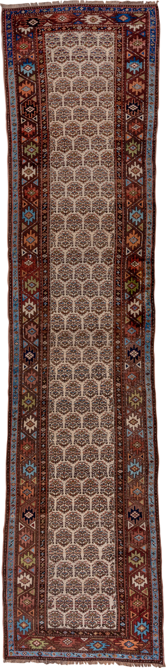 3' x 16' one-of-a-kind handmade vintage Kurd runner rug. Color palette: ivory, rust, brown, sky_blue, indigo, camel, navy