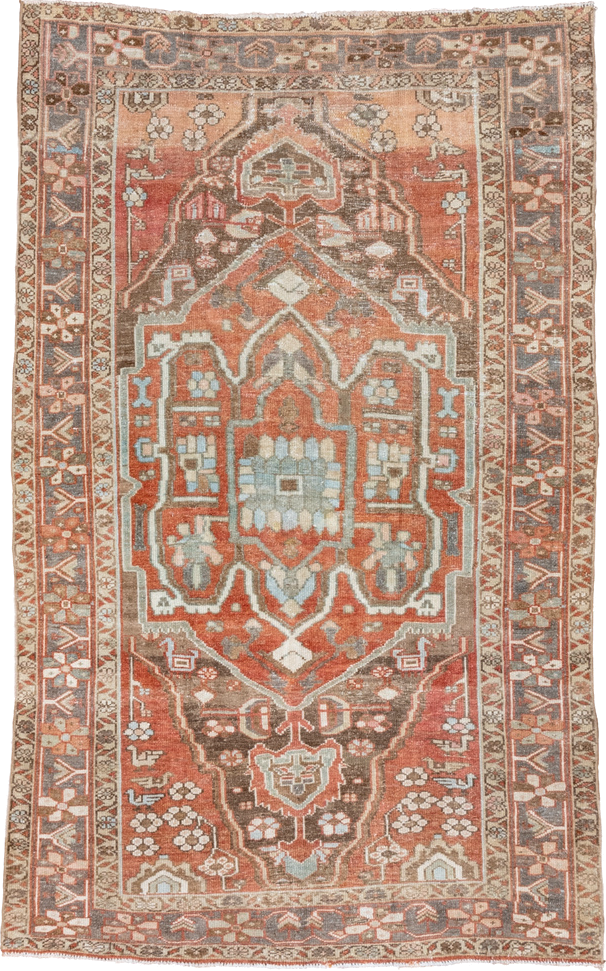 4' x 7' one-of-a-kind handmade vintage Serapi rug. Color palette: terra cotta, rust, slate, ivory, taupe, charcoal, camel