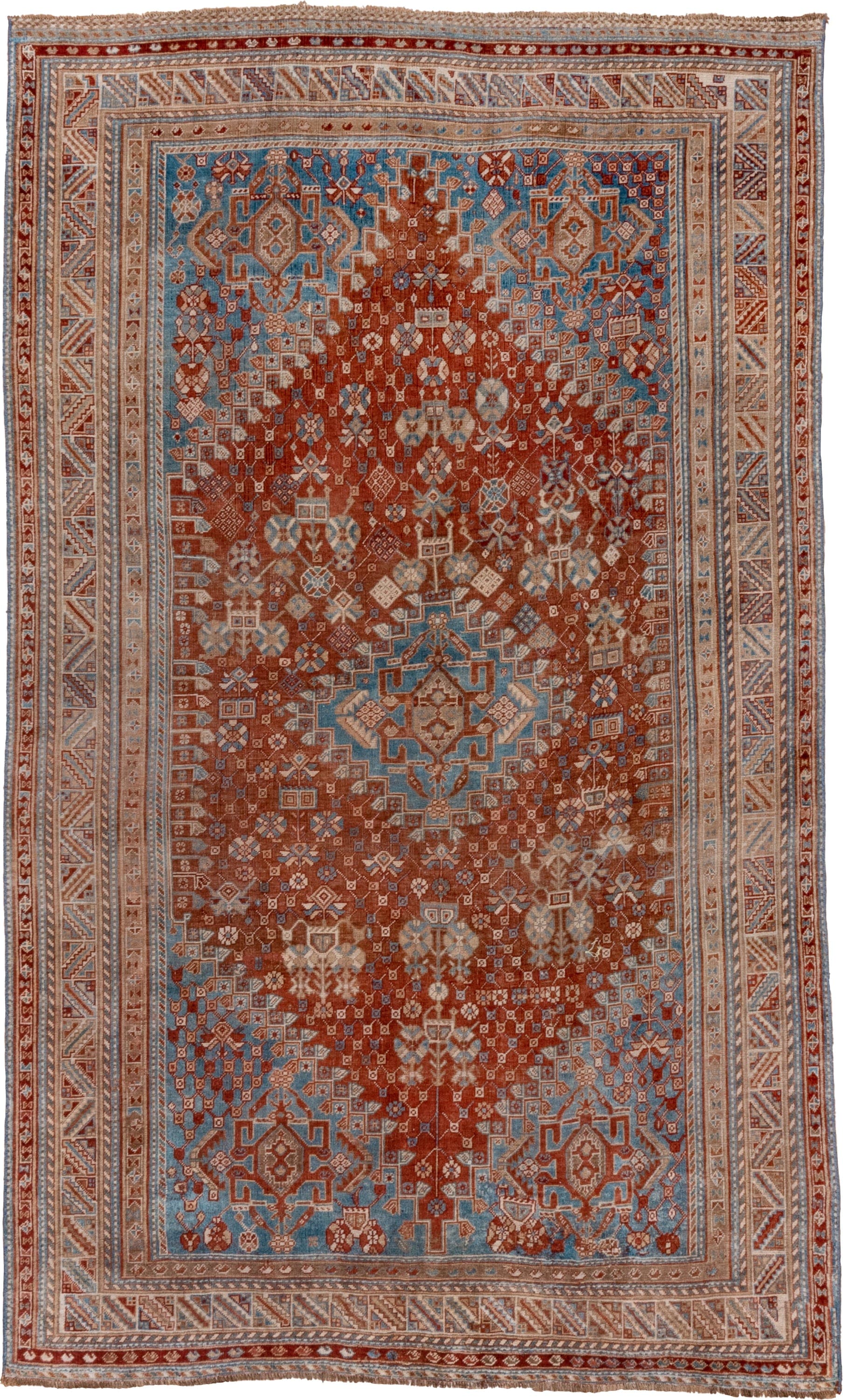 5' x 9' one-of-a-kind handmade vintage Qashqai medium size rug. Color palette: rust, sky blue, ivory, camel, taupe