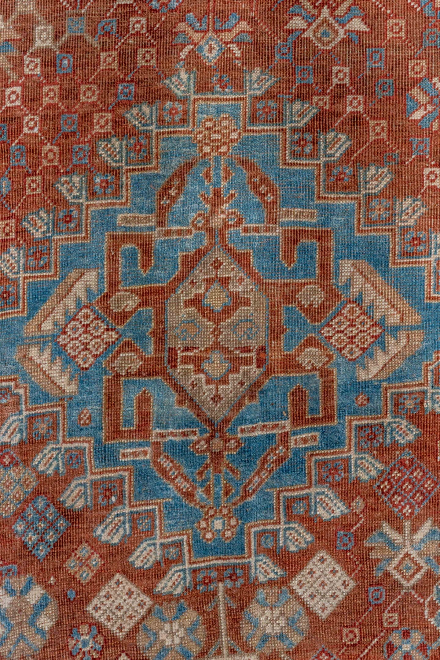 5' x 9' one-of-a-kind handmade vintage Qashqai medium size rug. Color palette: rust, sky blue, ivory, camel, taupe