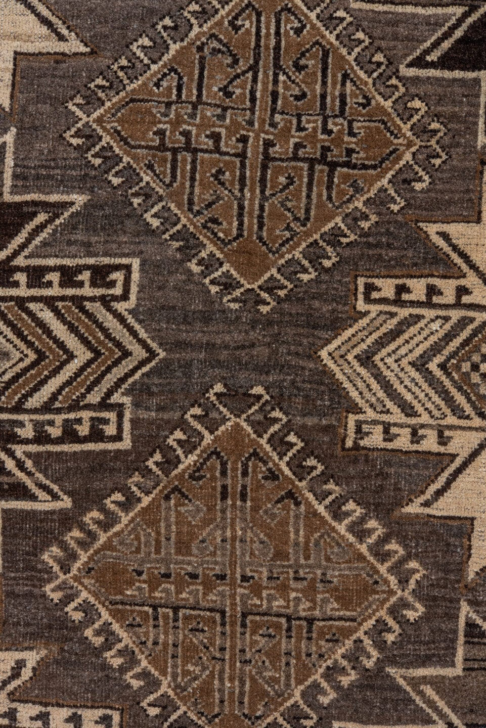 7' x 9' one-of-a-kind handmade vintage Afghan rug. Color palette: taupe, brown, ivory, charcoal, camel, beige, gray, black