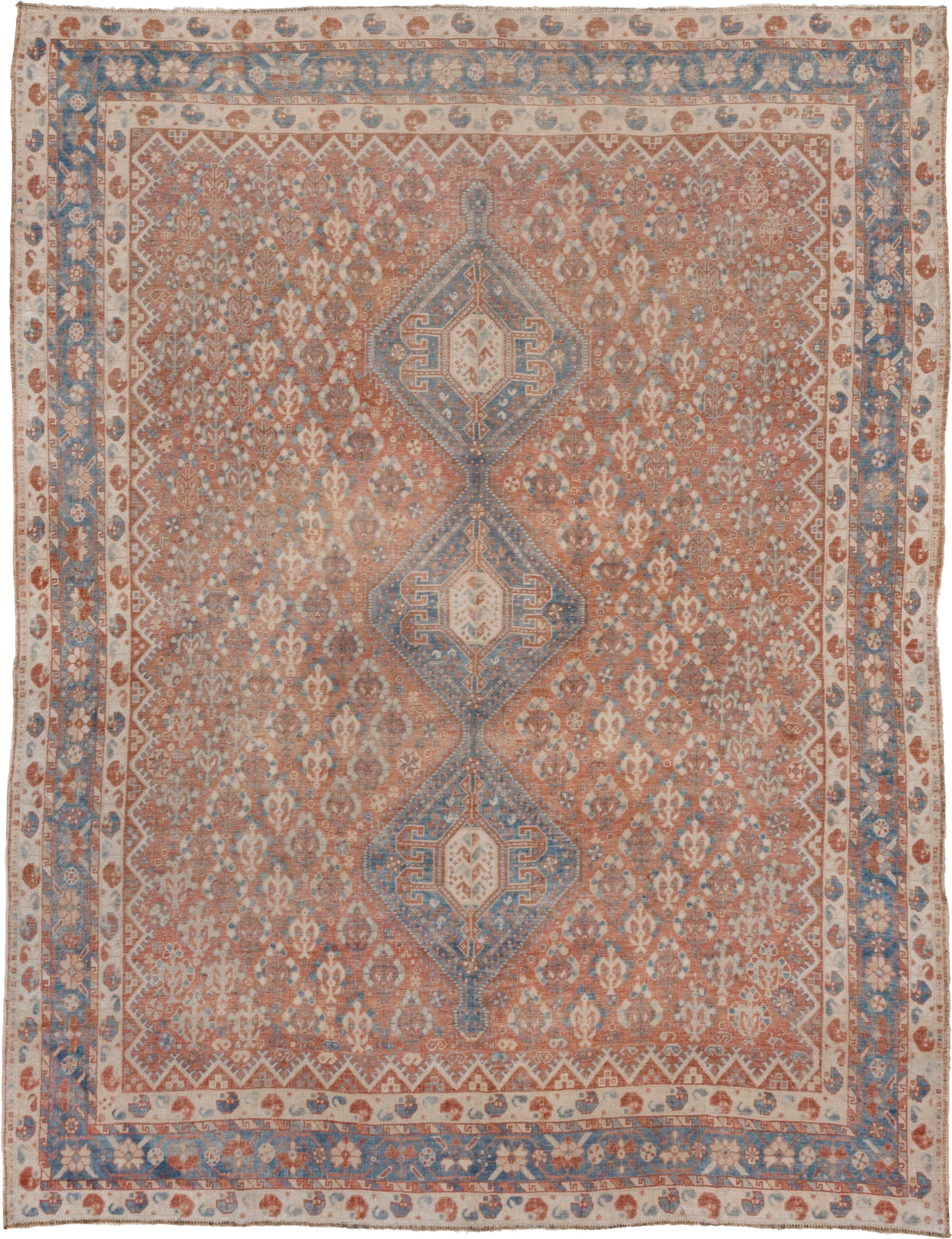 7' x 9' one-of-a-kind handmade vintage Shiraz rug. Color palette: terra cotta, ivory, sky blue, rust, beige, slate