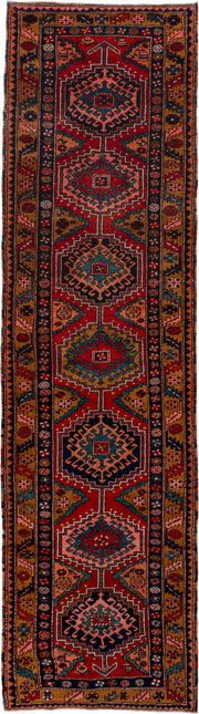 3' x 12' one-of-a-kind handmade vintage Heriz runner rug. Color palette: rust, navy, terra cotta, camel, ivory, teal, rose