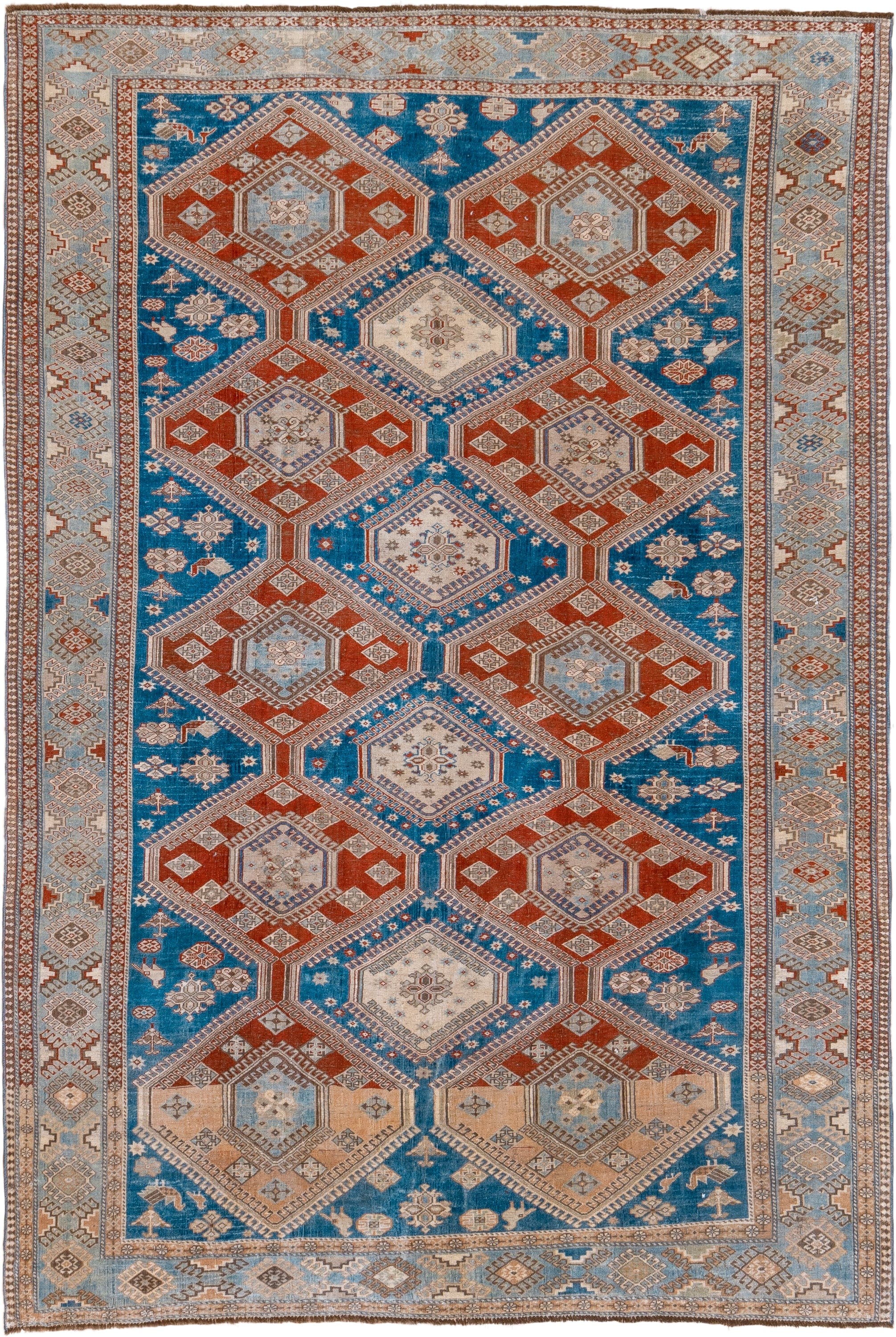 7' x 10' one-of-a-kind handmade vintage Shiraz large size rug. Color palette: blue, ivory, rust, light blue, camel, taupe