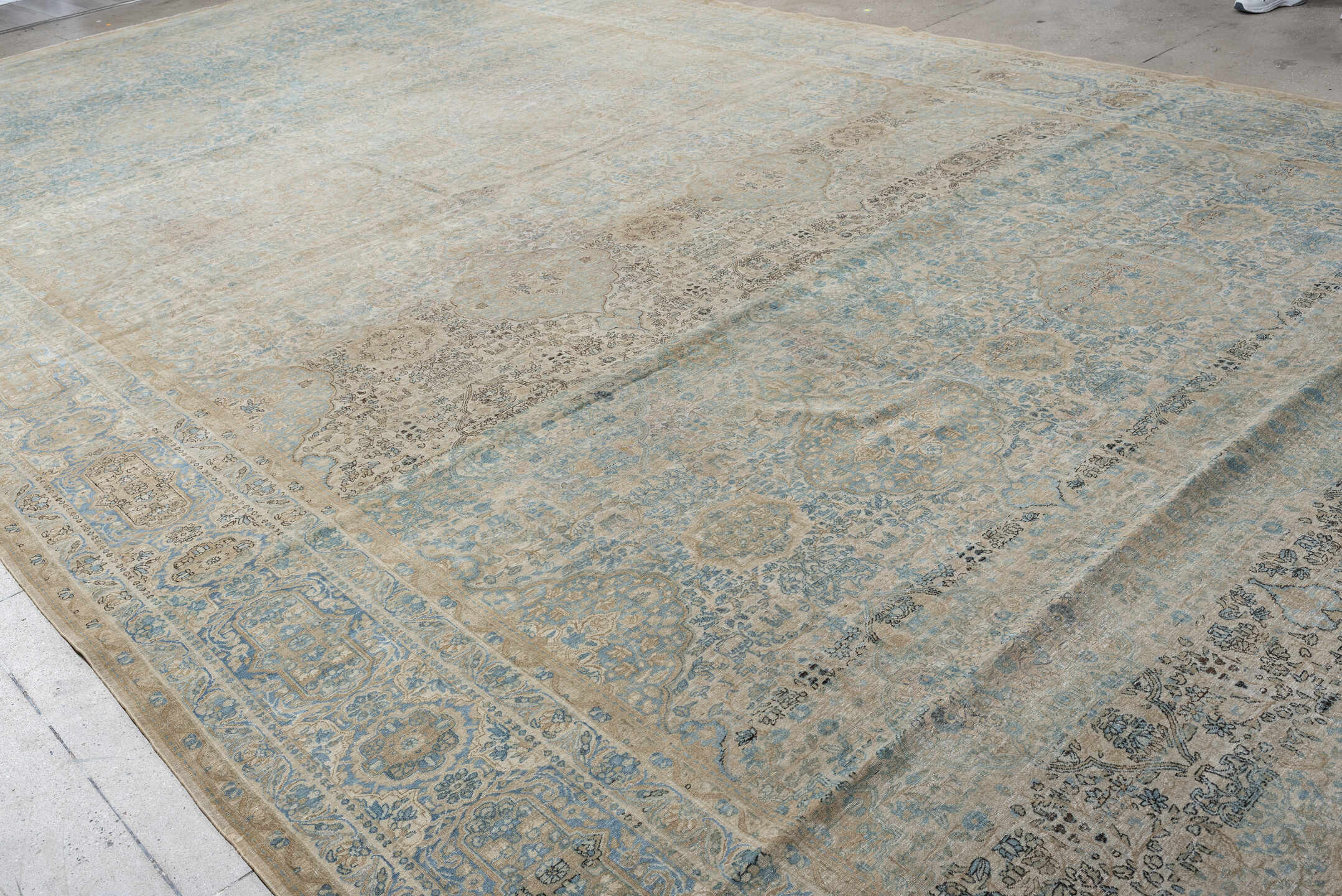 12' x 23' one-of-a-kind handmade vintage Kerman oversize rug. Color palette: ivory, sky blue, taupe, beige, slate, sand