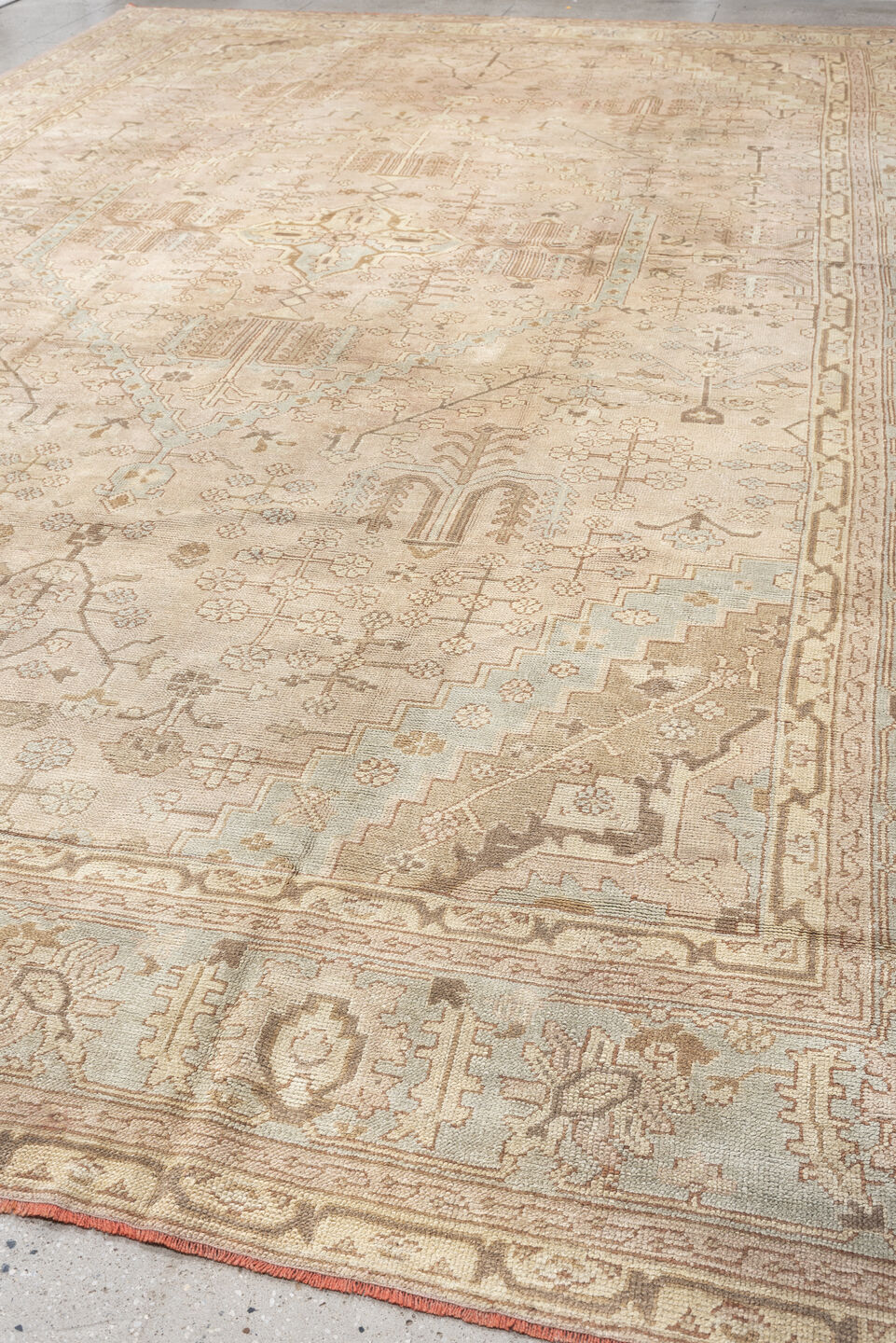 12' x 18' one-of-a-kind handmade antique Oushak oversize rug. Color palette: ivory, taupe, pale blue, faded terracotta
