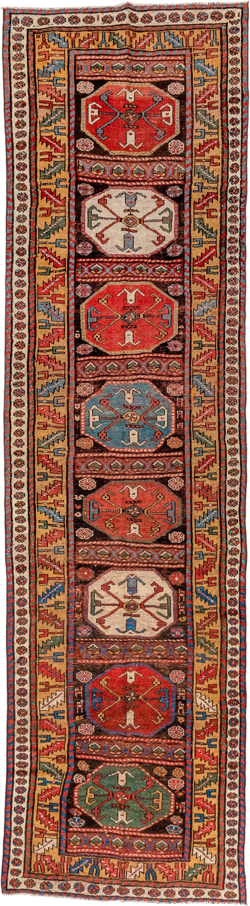 3' x 12' one-of-a-kind handmade vintage Kurd runner rug. Color palette: rust, ivory, camel, sky blue, navy, coral, brown
