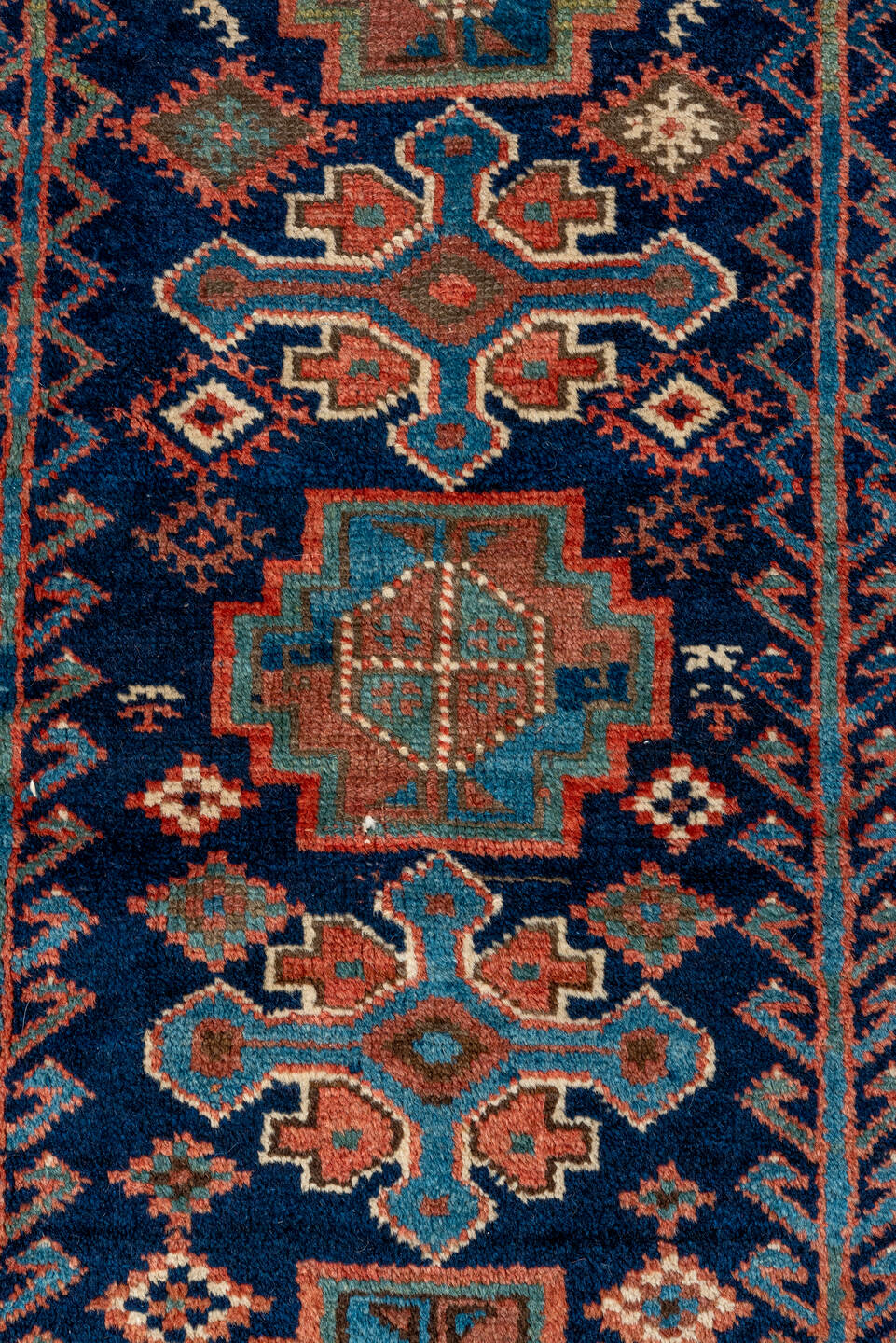 4' x 5' one-of-a-kind handmade vintage Kurd small size rug. Color palette: navy, turquoise, rust, ivory, coral, camel, blue