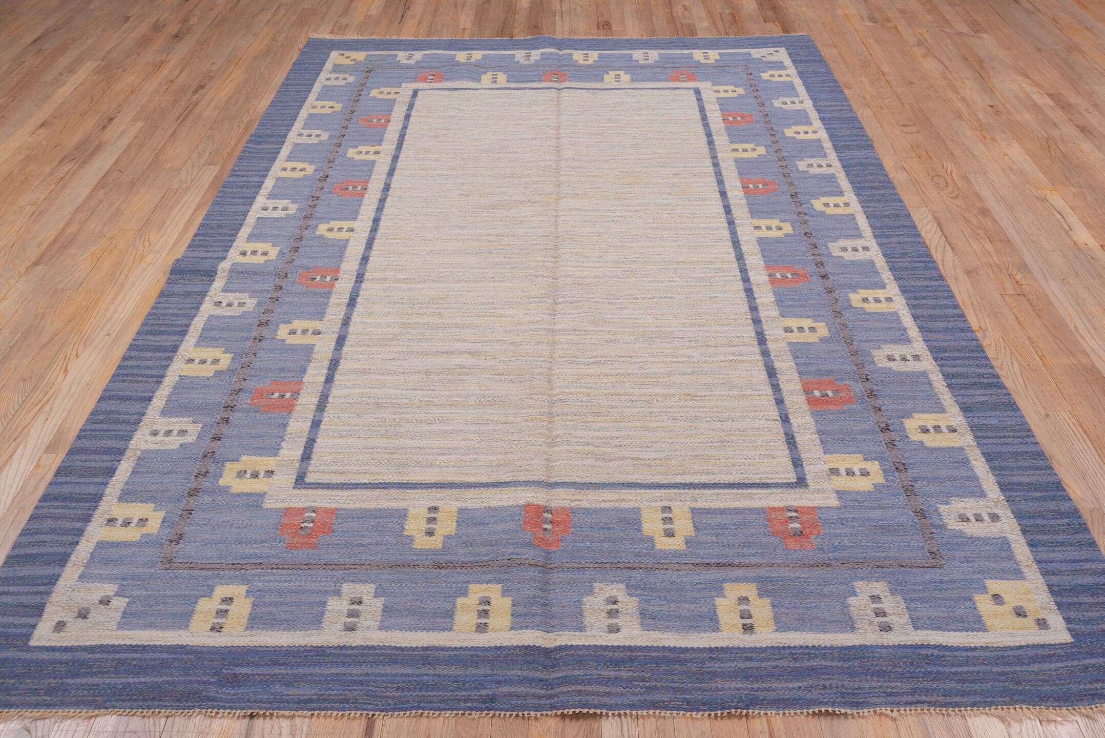 6' x 10' one-of-a-kind handmade vintage Rollaken large size rug. Color palette: ivory, slate blue, periwinkle, cream