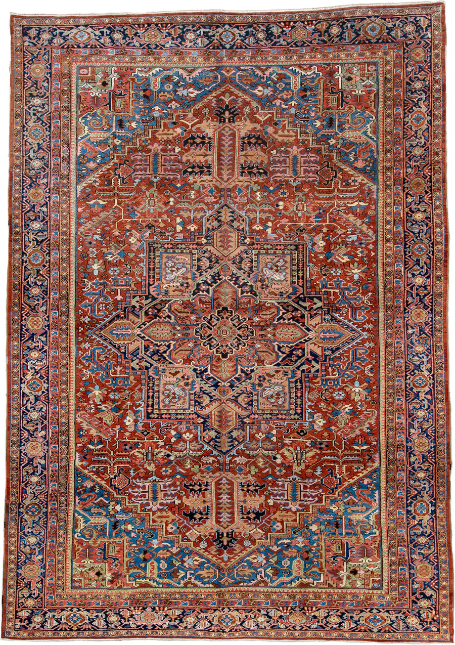 11' x 16' one-of-a-kind handmade antique Heriz oversize rug. Color palette: rust, navy, ivory, turquoise, terracotta, sage