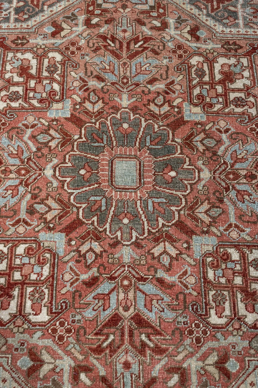 11' x 15' one-of-a-kind handmade antique Heriz oversize rug. Color palette: rust, ivory, sage, slate blue, dusty rose, taupe