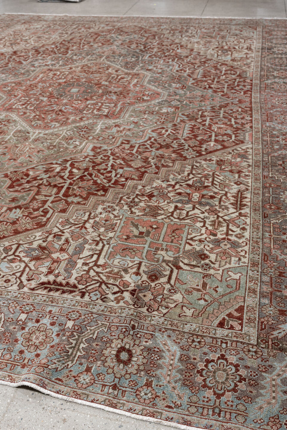 11' x 15' one-of-a-kind handmade antique Heriz oversize rug. Color palette: rust, ivory, sage, slate blue, dusty rose, taupe