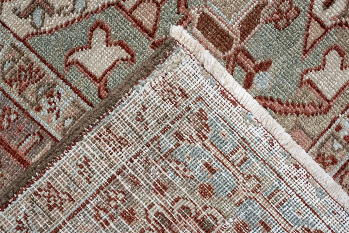 11' x 15' one-of-a-kind handmade antique Heriz oversize rug. Color palette: rust, ivory, sage, slate blue, dusty rose, taupe