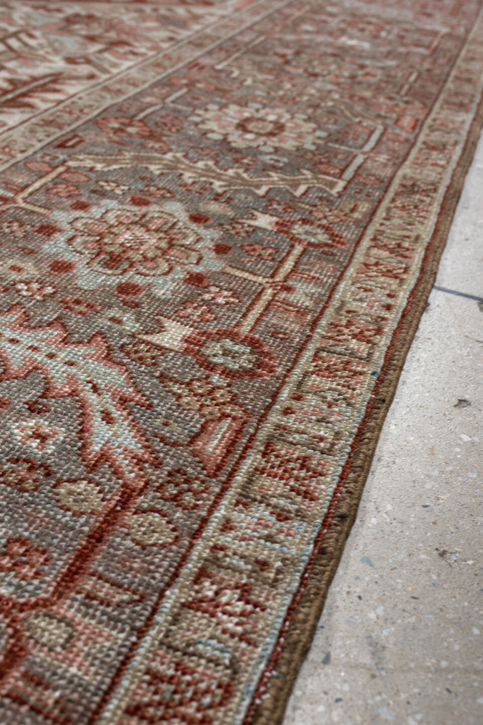 11' x 15' one-of-a-kind handmade antique Heriz oversize rug. Color palette: rust, ivory, sage, slate blue, dusty rose, taupe