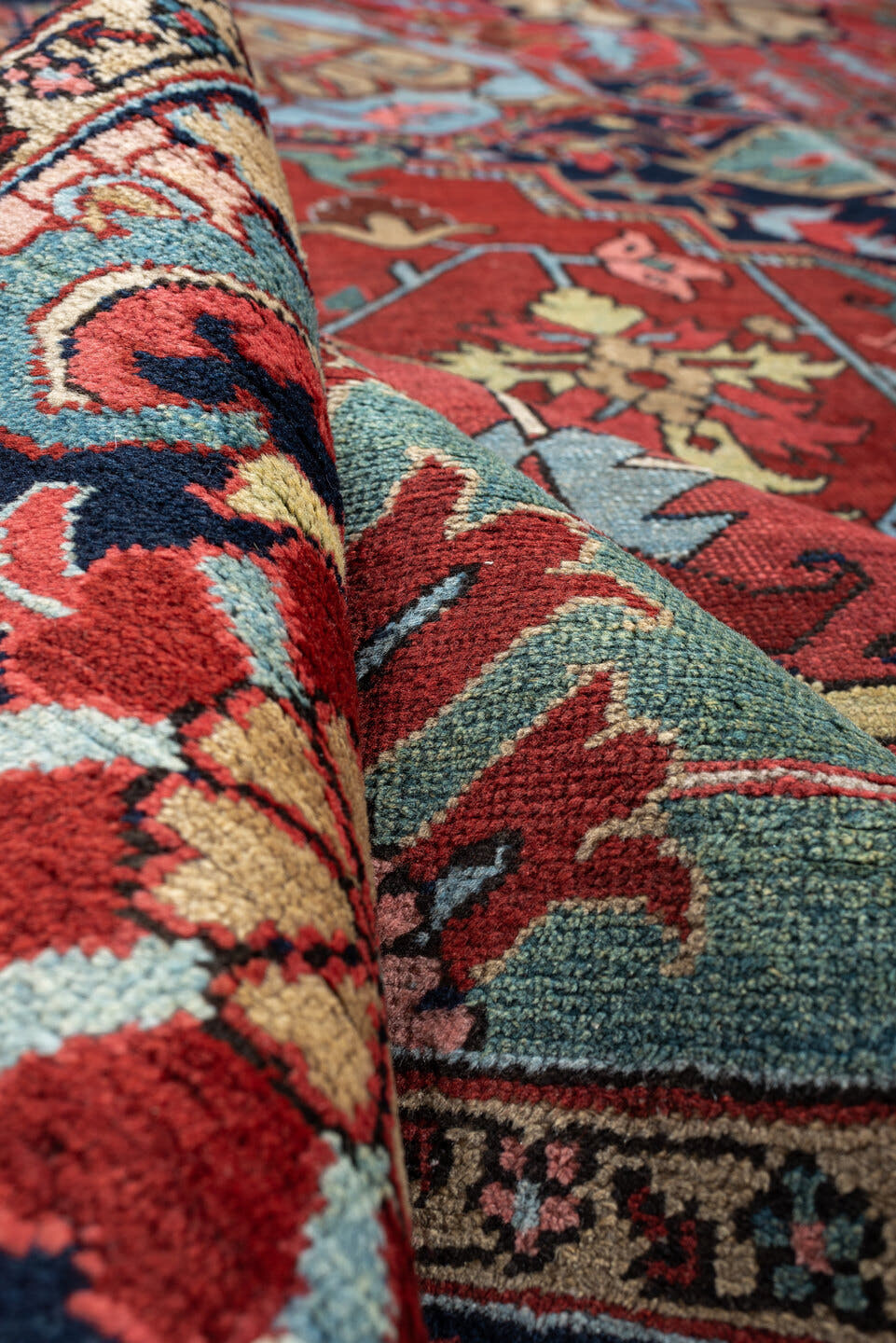 12' x 15' one-of-a-kind handmade antique Heriz oversize rug. Color palette: brick red, navy, turquoise, ivory, sage, coral