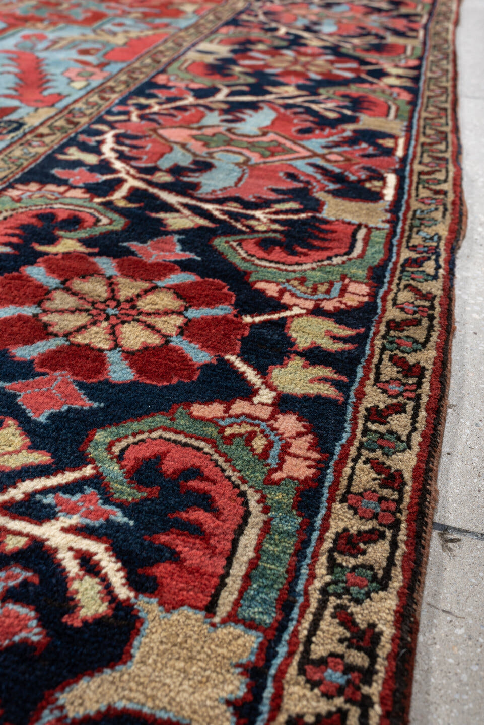 12' x 15' one-of-a-kind handmade antique Heriz oversize rug. Color palette: brick red, navy, turquoise, ivory, sage, coral