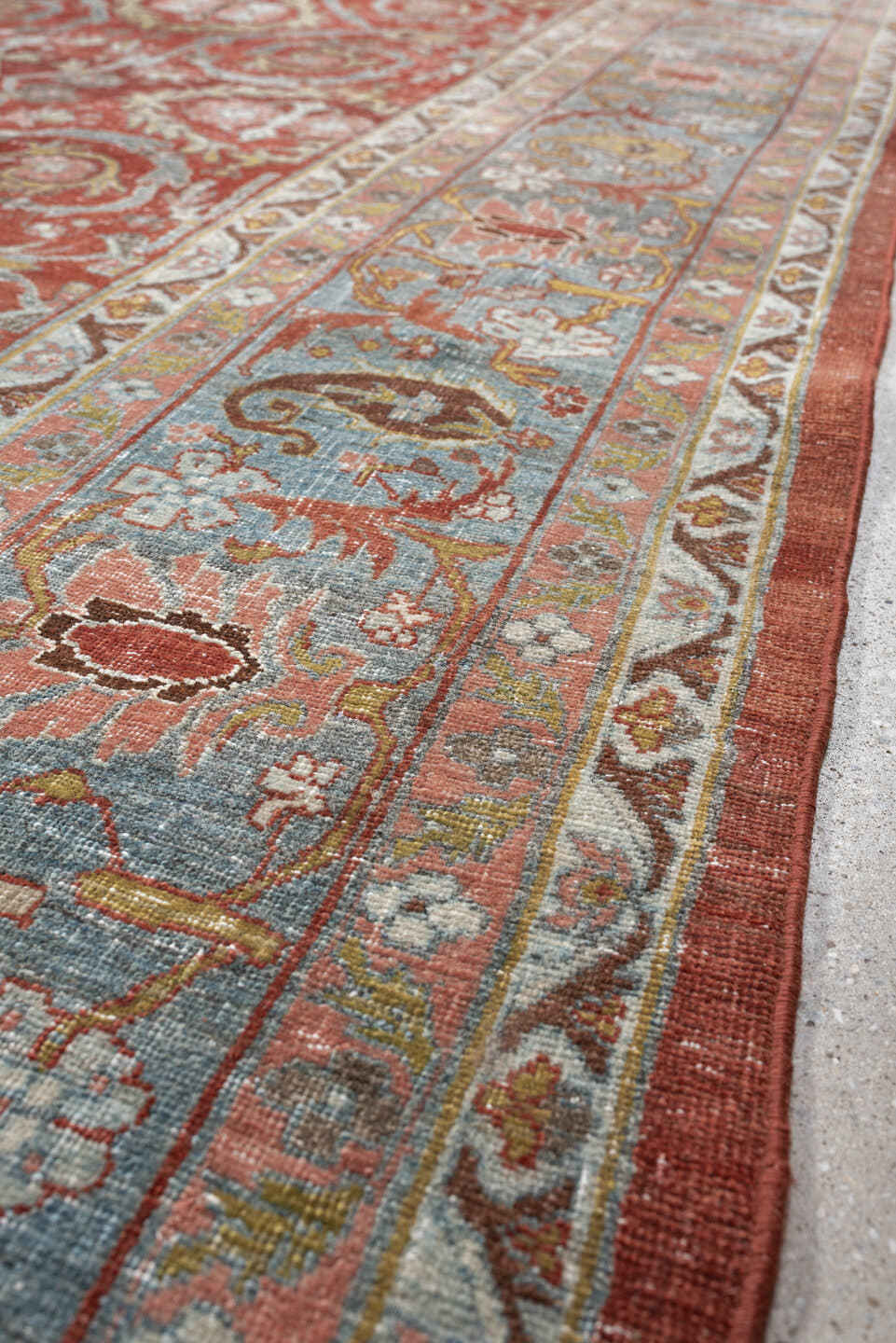 11' x 18' one-of-a-kind handmade antique Bidjar oversize rug. Color palette: terracotta, powder blue, ivory, rust, sage