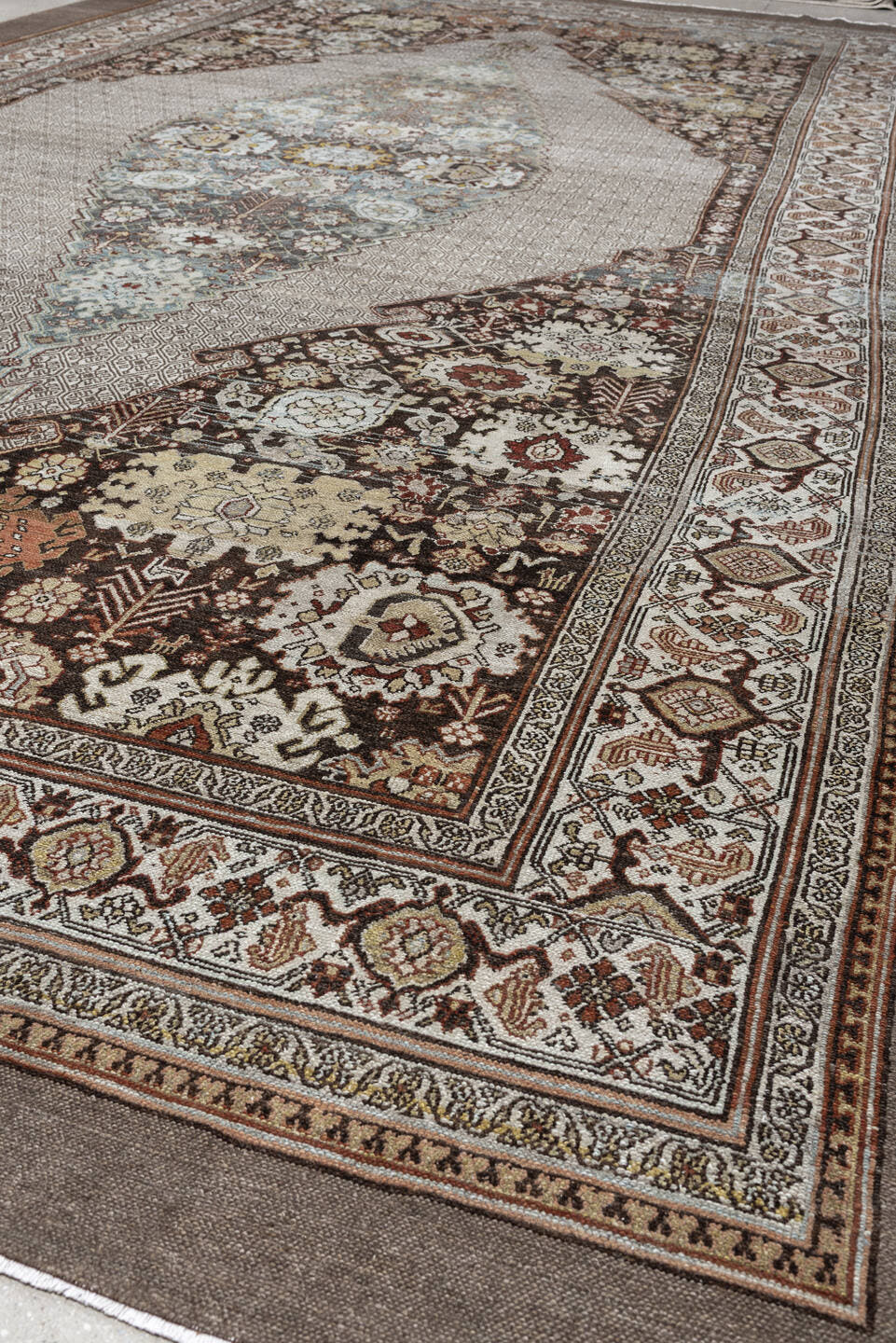 11' x 19' one-of-a-kind handmade antique Bibikabad oversize rug. Color palette: ivory, taupe, ebony, powder blue, rust