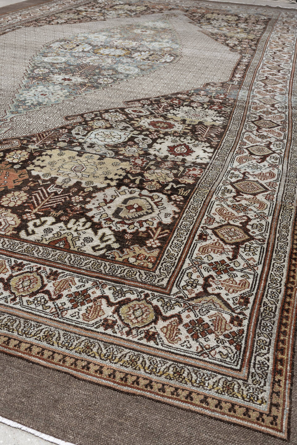 11' x 19' one-of-a-kind handmade antique Bibikabad oversize rug. Color palette: ivory, taupe, ebony, powder blue, rust