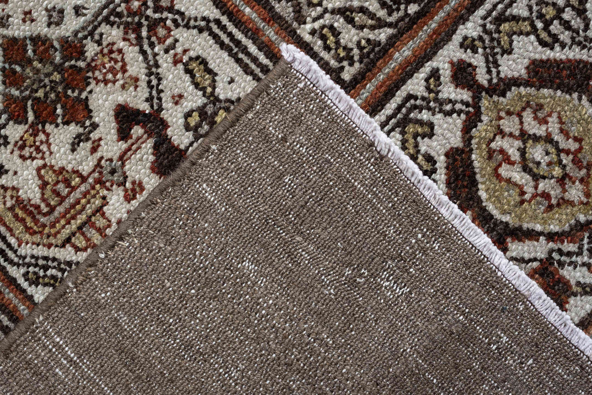 11' x 19' one-of-a-kind handmade antique Bibikabad oversize rug. Color palette: ivory, taupe, ebony, powder blue, rust