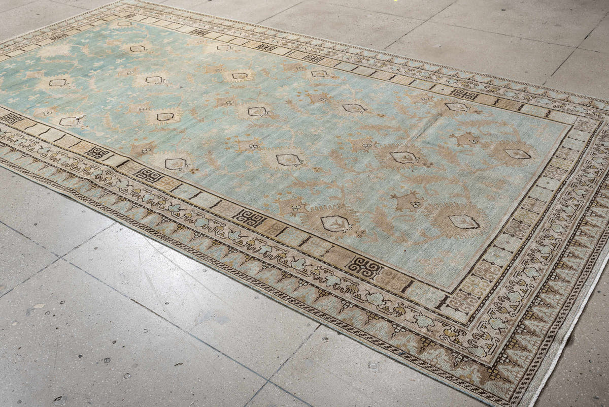 6' x 12' one-of-a-kind handmade antique Khotan large size rug. Color palette: aqua, ivory, beige, tan, taupe, charcoal