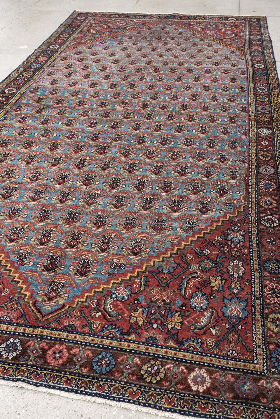 5' x 10' one-of-a-kind handmade antique Malayer rug. Color palette: turquoise, madder red, navy, ivory, saffron, charcoal