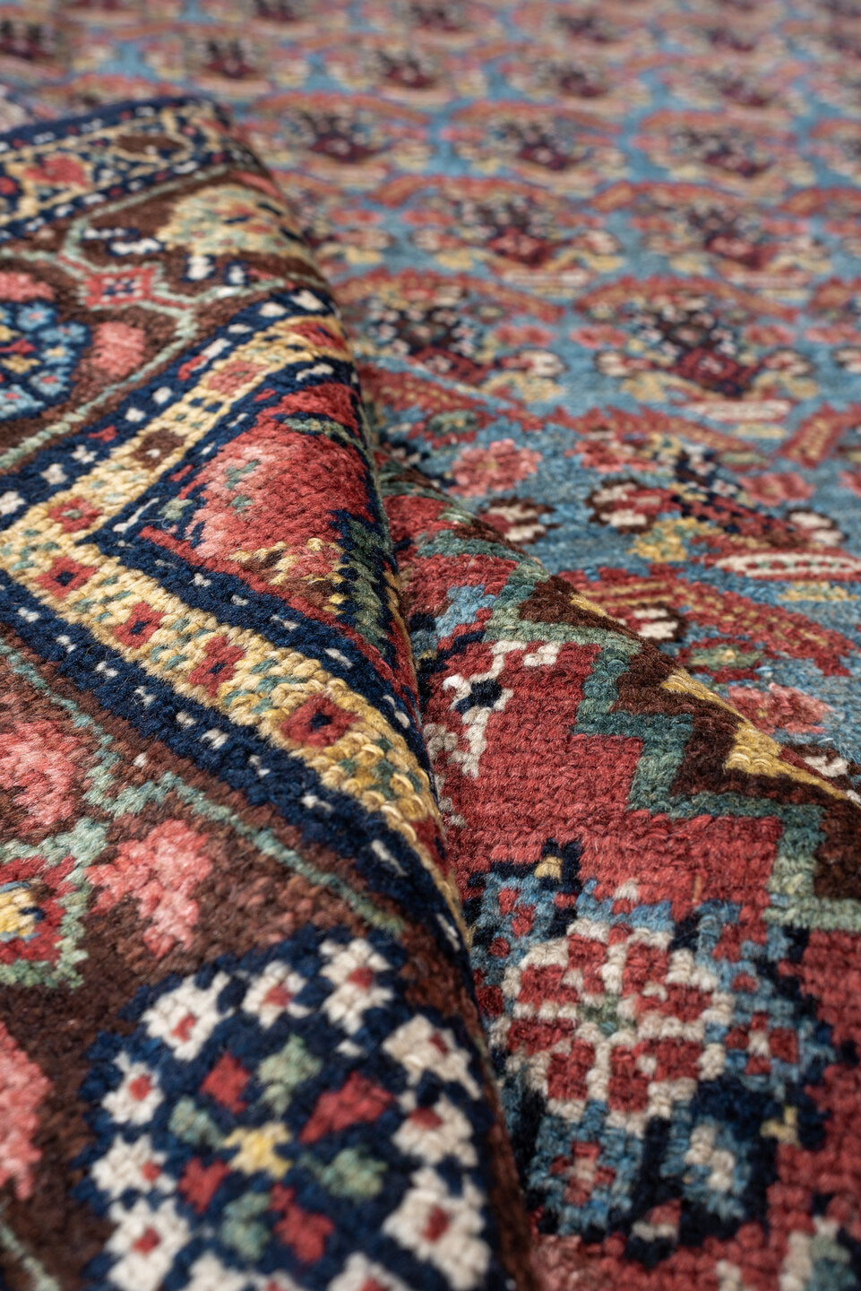 5' x 10' one-of-a-kind handmade antique Malayer rug. Color palette: turquoise, madder red, navy, ivory, saffron, charcoal