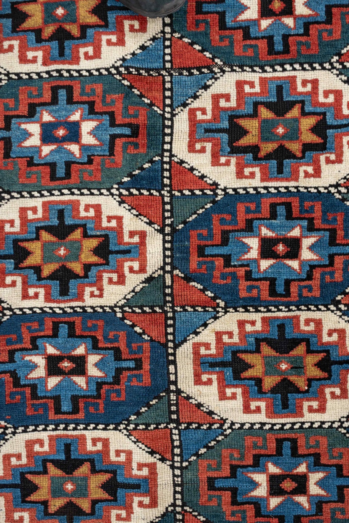 4' x 8' one-of-a-kind handmade vintage Kazak medium size rug. Color palette: teal, ivory, rust, navy, coral, charcoal, gold
