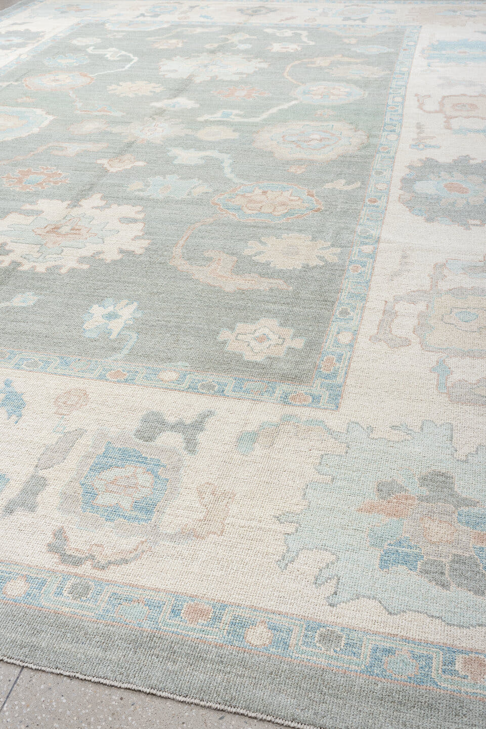 13' x 17' one-of-a-kind handmade vintage Oushak oversize rug. Color palette: pale blue, ivory, taupe, blush, cream, sky blue
