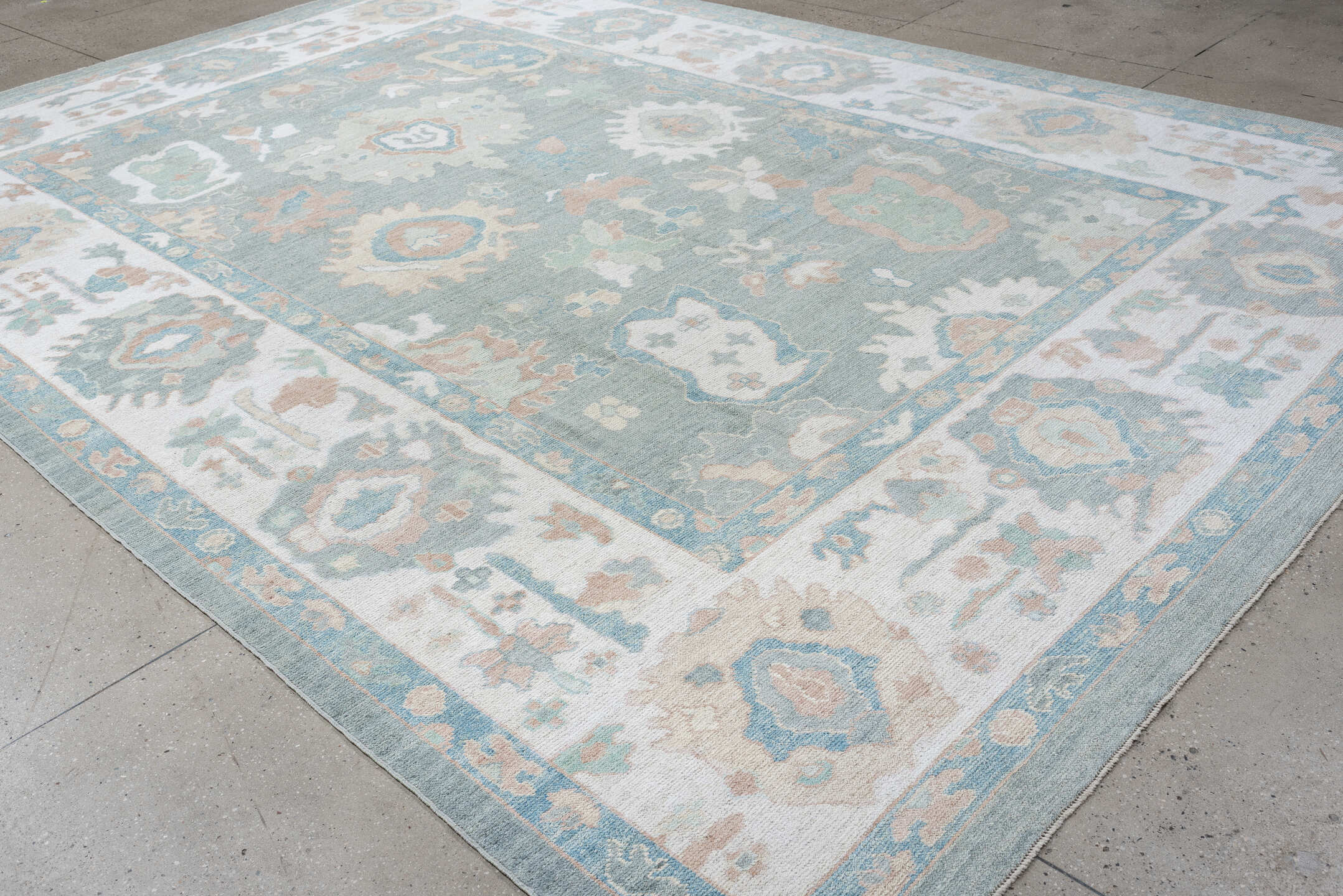 10' x 14' one-of-a-kind handmade vintage Oushak large size rug. Color palette: pale aqua, ivory, blush, sage, taupe, cream