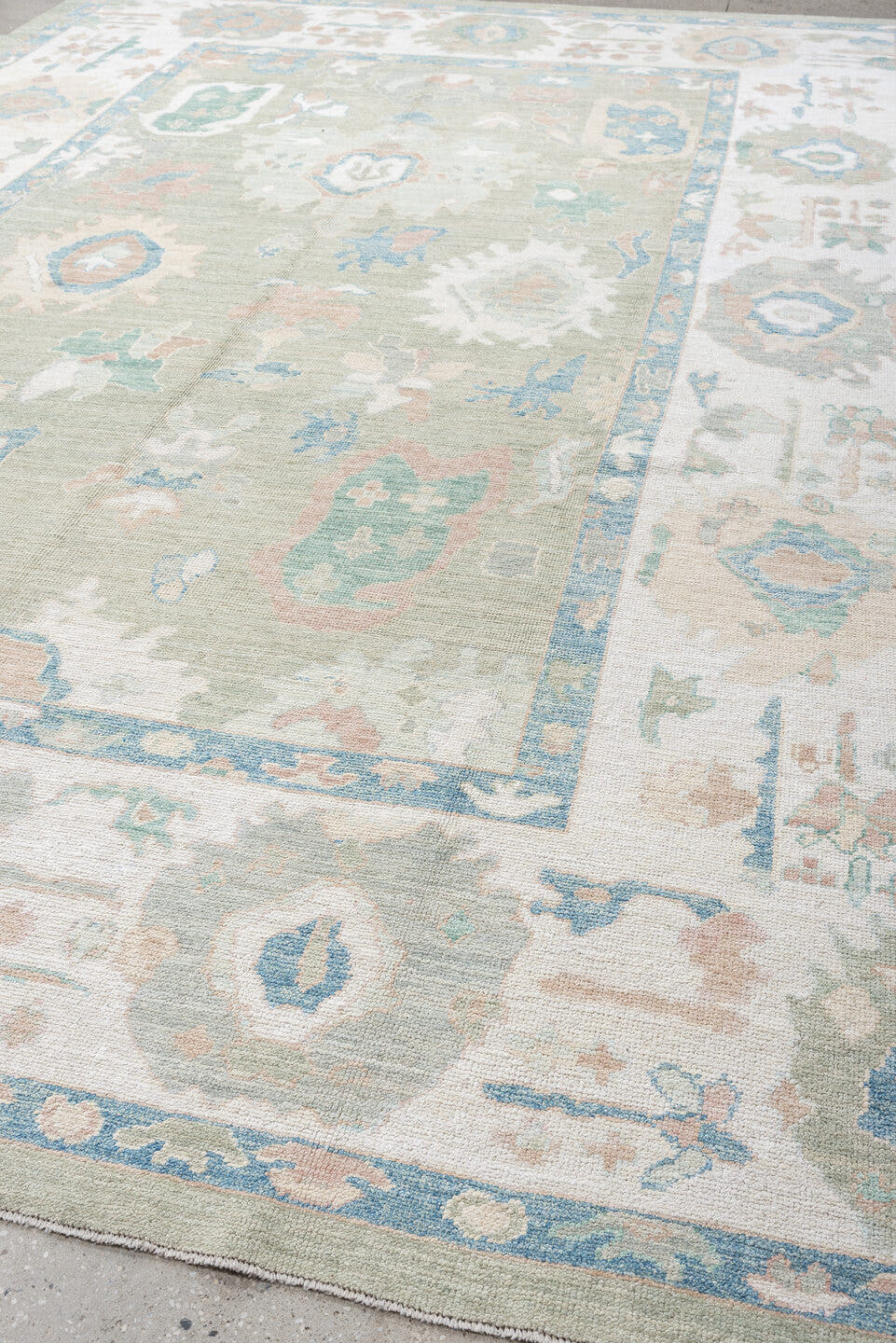 9' x 14' one-of-a-kind handmade vintage Oushak large size rug. Color palette: sage, ivory, sky blue, blush, taupe, cream