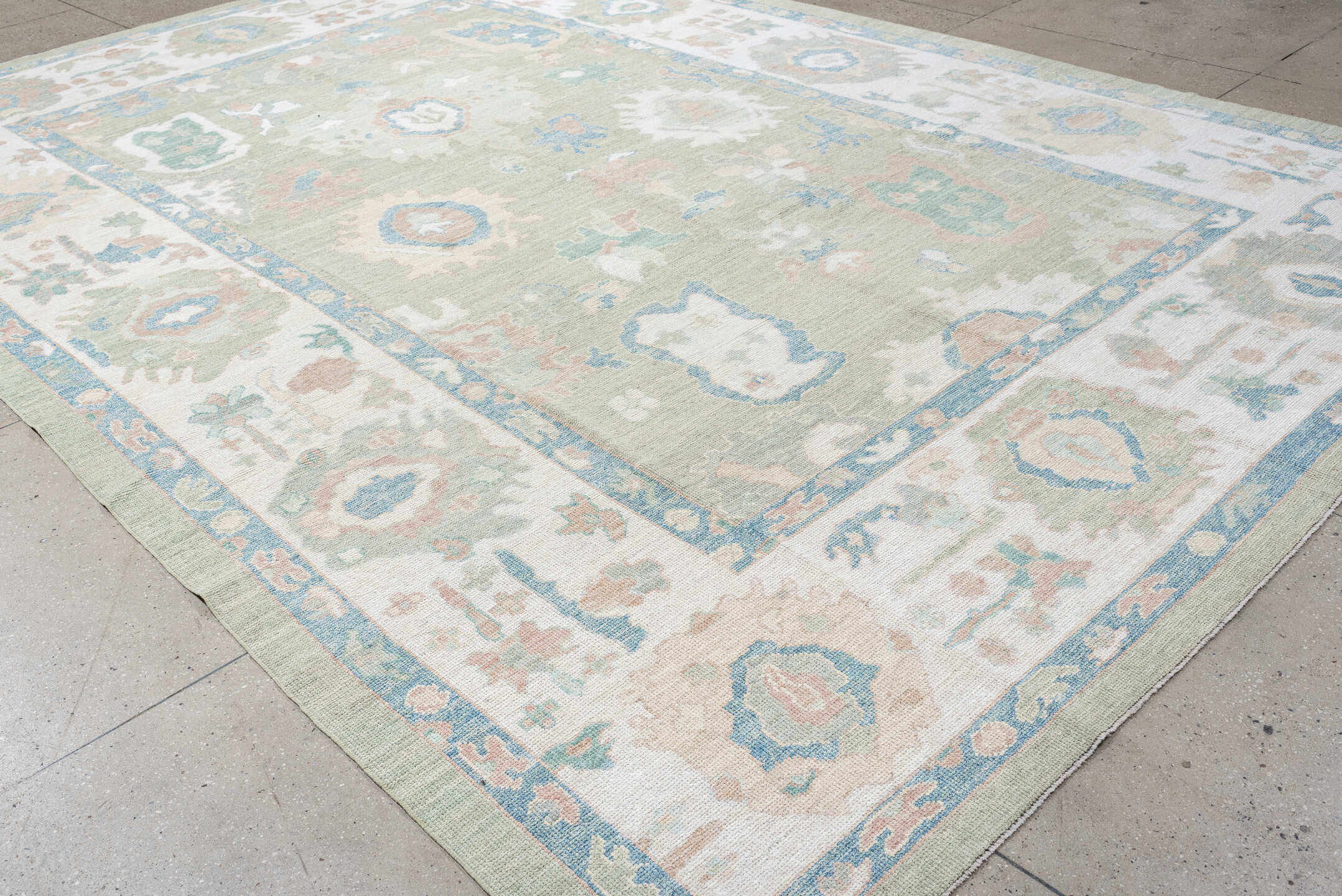 9' x 14' one-of-a-kind handmade vintage Oushak large size rug. Color palette: sage, ivory, sky blue, blush, taupe, cream