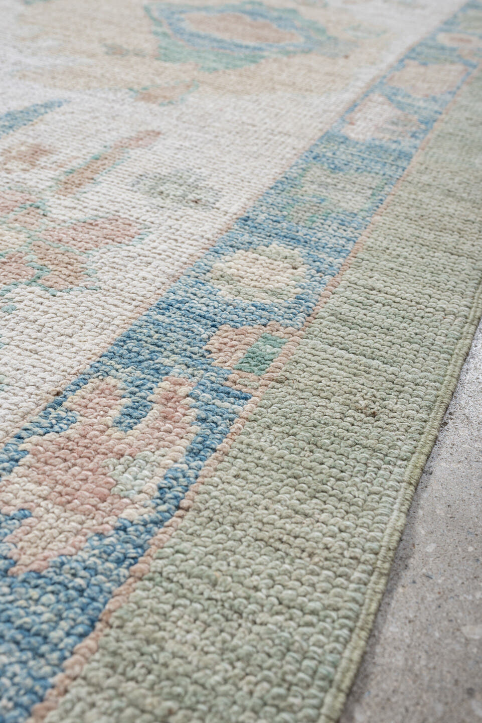 9' x 14' one-of-a-kind handmade vintage Oushak large size rug. Color palette: sage, ivory, sky blue, blush, taupe, cream