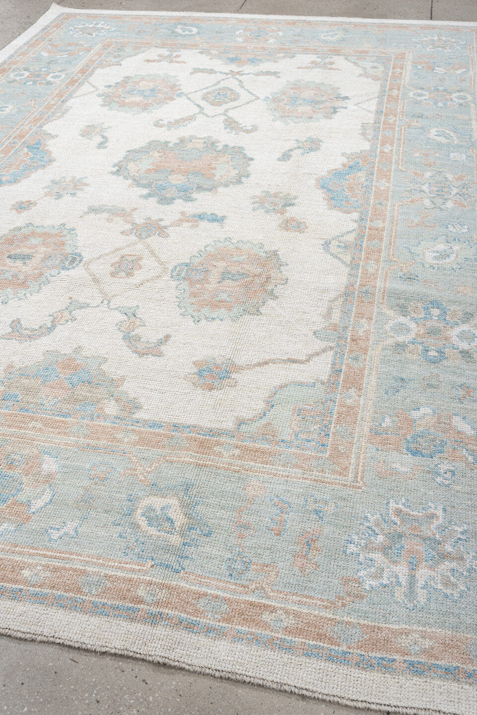7' x 10' one-of-a-kind handmade vintage Oushak large size rug. Color palette: ivory, pale aqua, blush, taupe, cream, teal