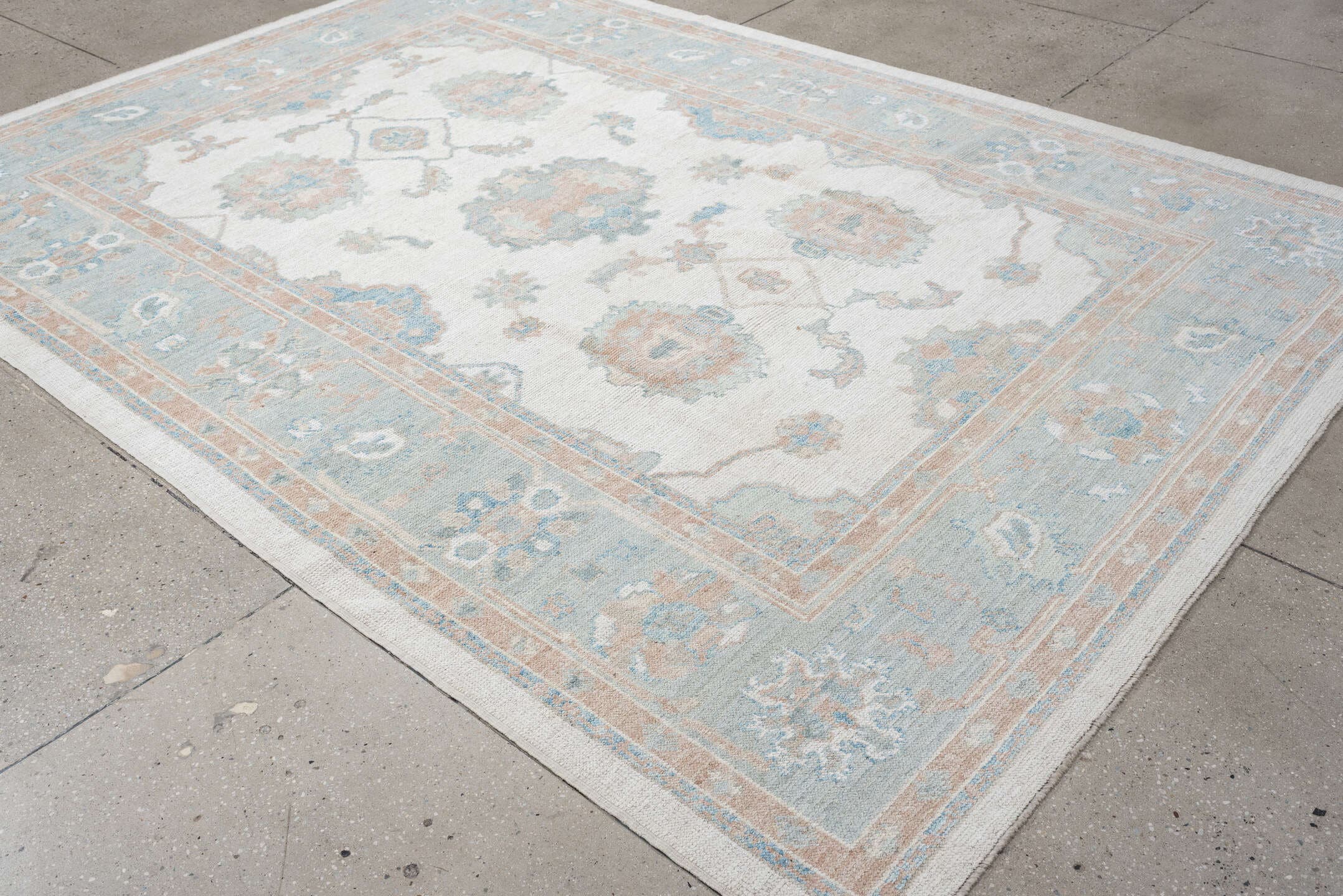 7' x 10' one-of-a-kind handmade vintage Oushak large size rug. Color palette: ivory, pale aqua, blush, taupe, cream, teal