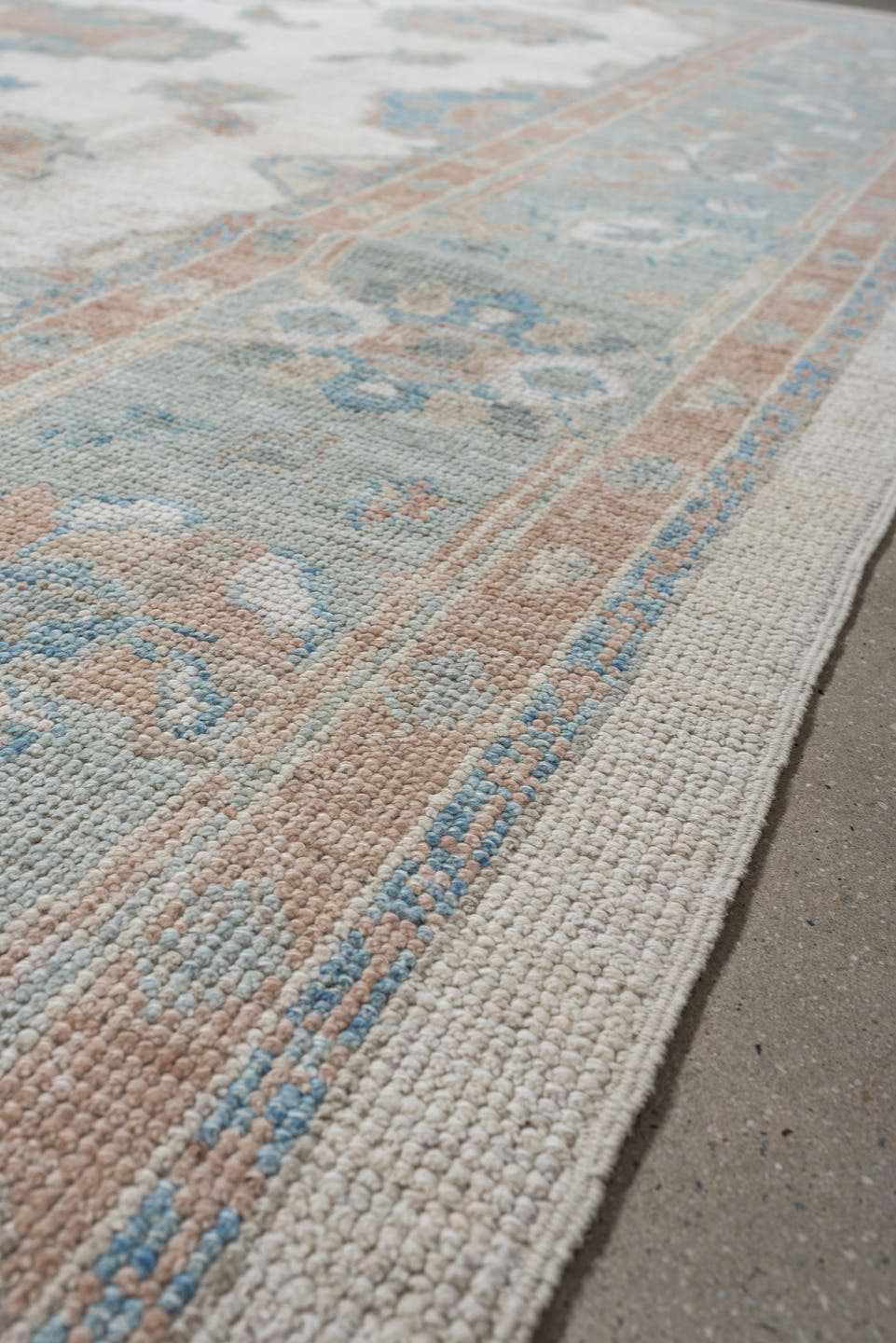 7' x 10' one-of-a-kind handmade vintage Oushak large size rug. Color palette: ivory, pale aqua, blush, taupe, cream, teal