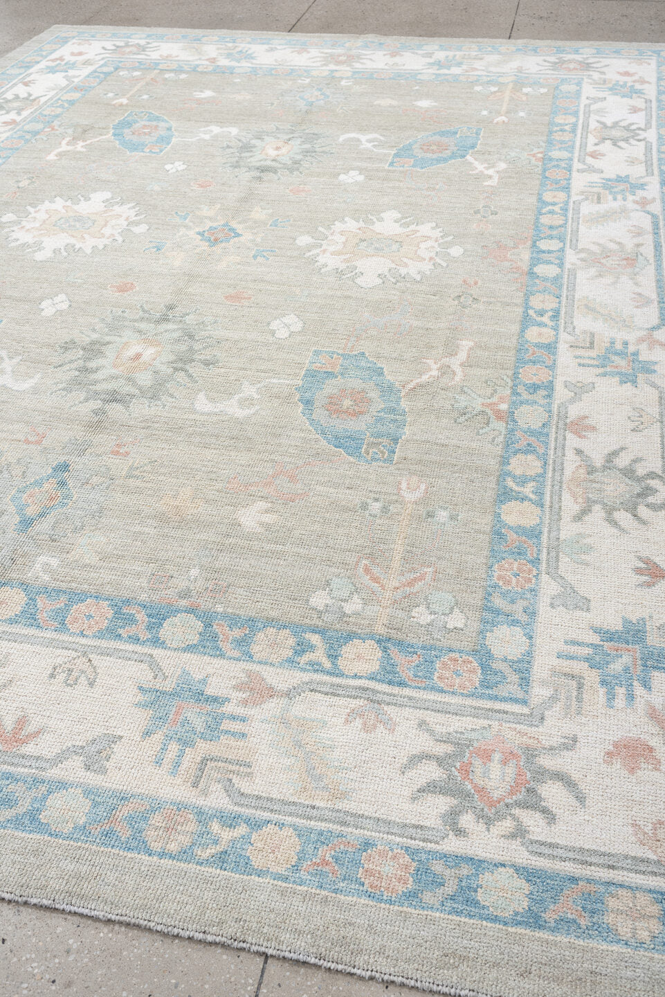 9' x 12' one-of-a-kind handmade vintage Oushak large size rug. Color palette: taupe, ivory, sky blue, peach, soft gray, sand