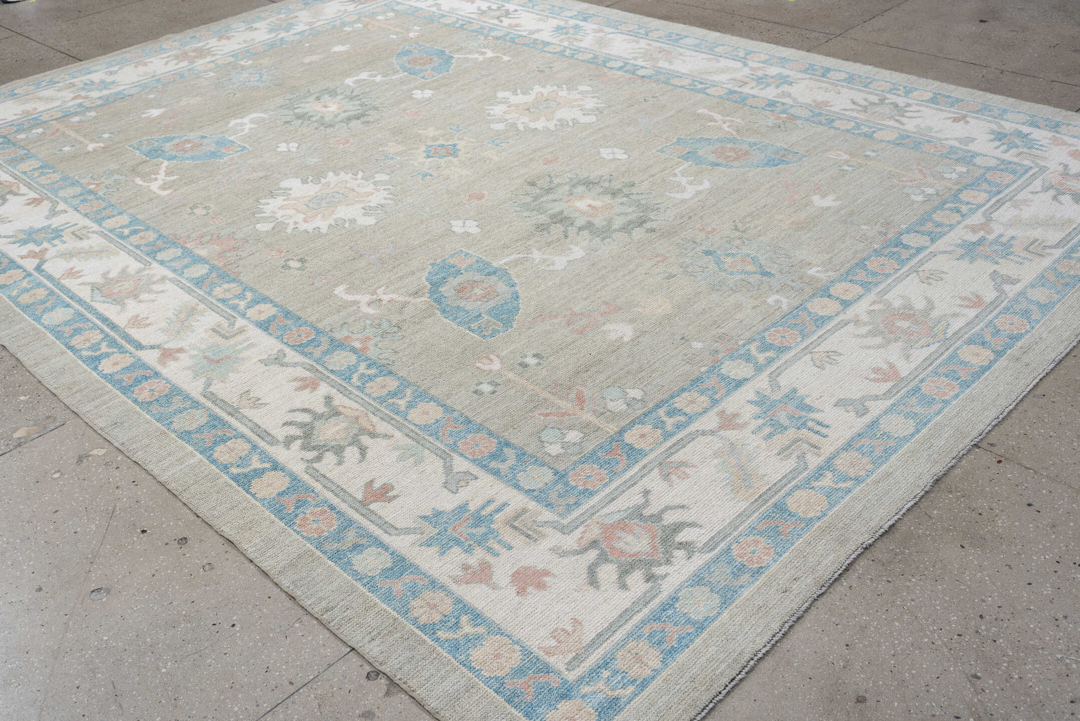 9' x 12' one-of-a-kind handmade vintage Oushak large size rug. Color palette: taupe, ivory, sky blue, peach, soft gray, sand