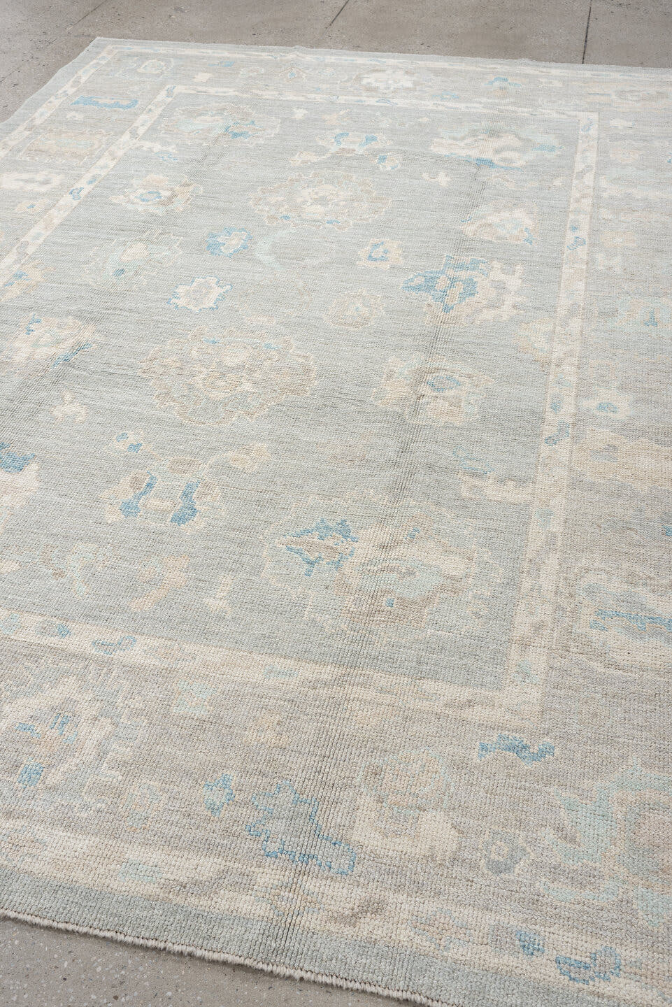 7' x 10' one-of-a-kind handmade vintage Oushak large size rug. Color palette: pale blue, ivory, taupe, cream, sky blue