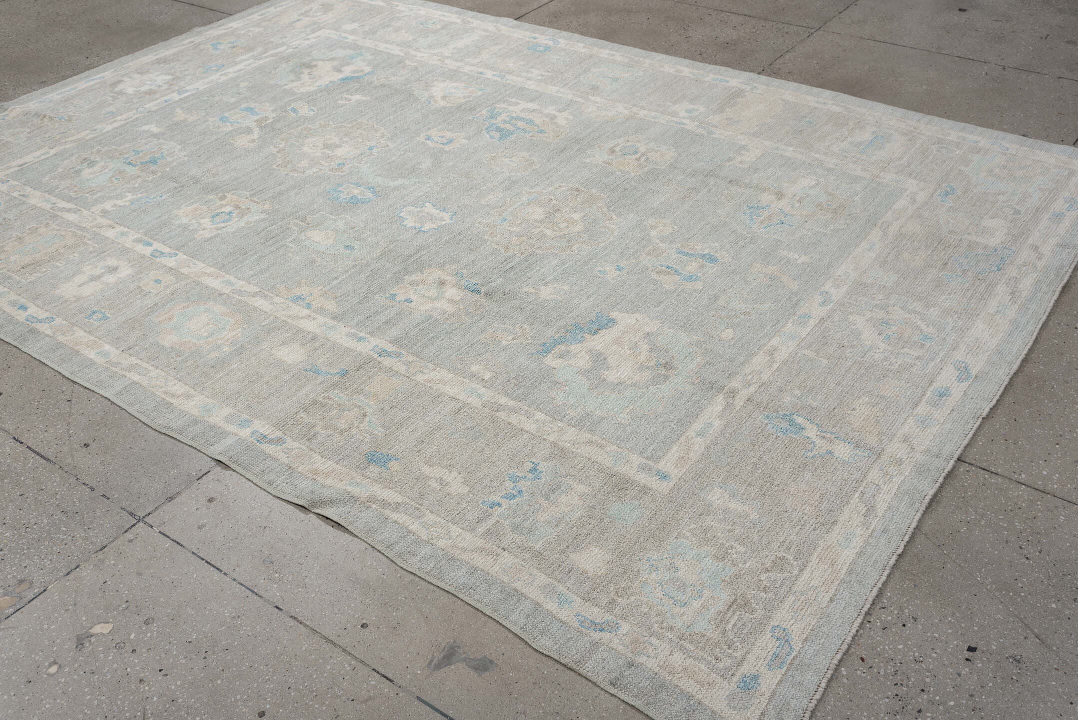 7' x 10' one-of-a-kind handmade vintage Oushak large size rug. Color palette: pale blue, ivory, taupe, cream, sky blue