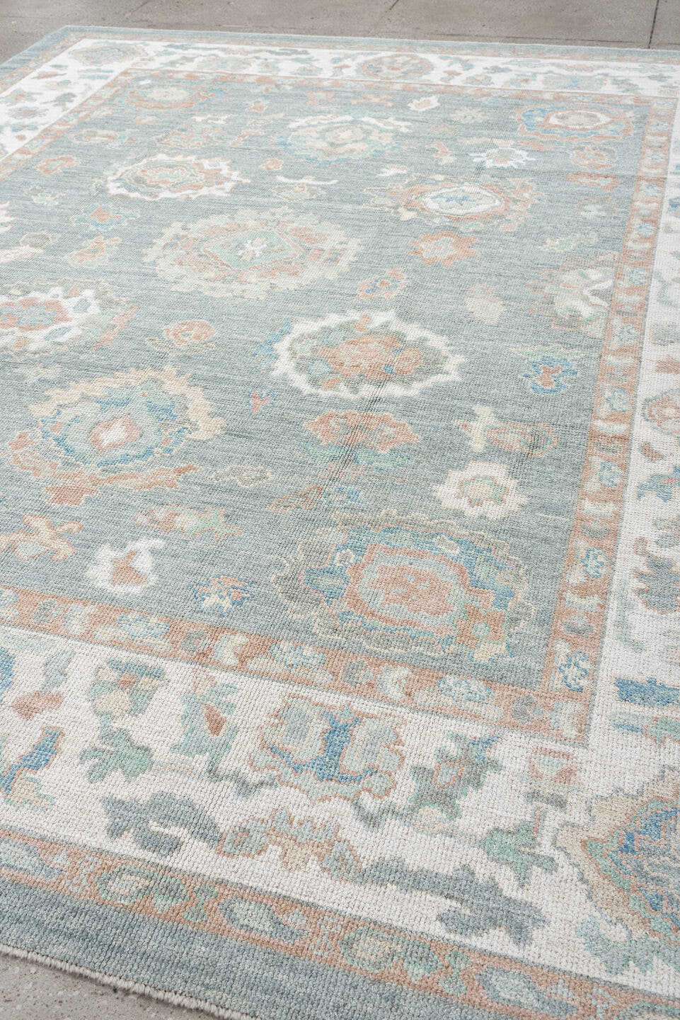 8' x 10' one-of-a-kind handmade vintage Oushak large size rug. Color palette: pale aqua, ivory, peach, sage, taupe, teal