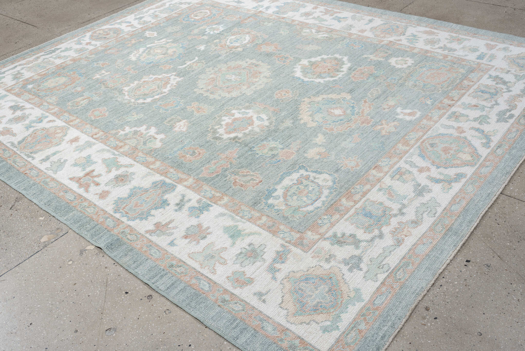 8' x 10' one-of-a-kind handmade vintage Oushak large size rug. Color palette: pale aqua, ivory, peach, sage, taupe, teal