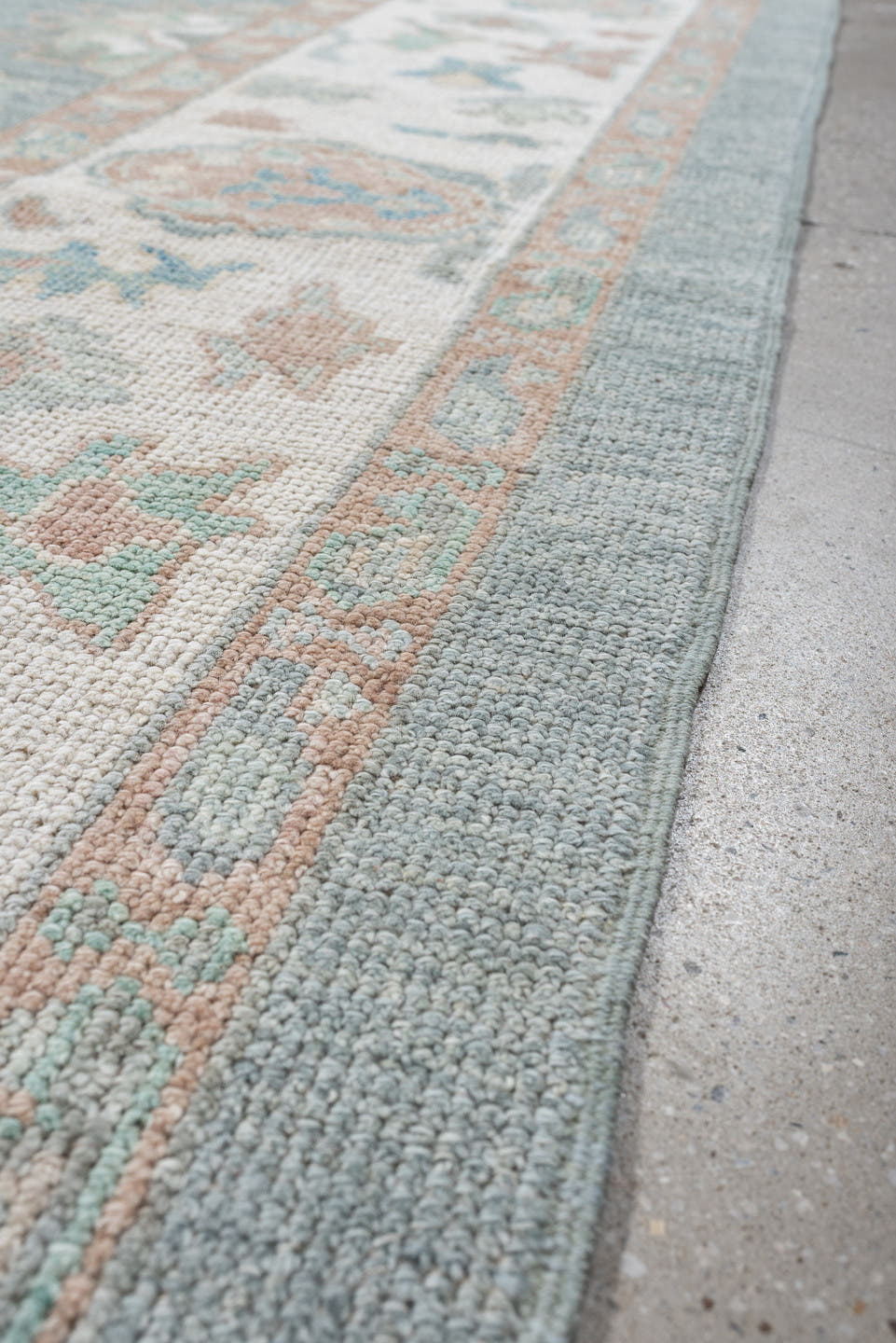 8' x 10' one-of-a-kind handmade vintage Oushak large size rug. Color palette: pale aqua, ivory, peach, sage, taupe, teal