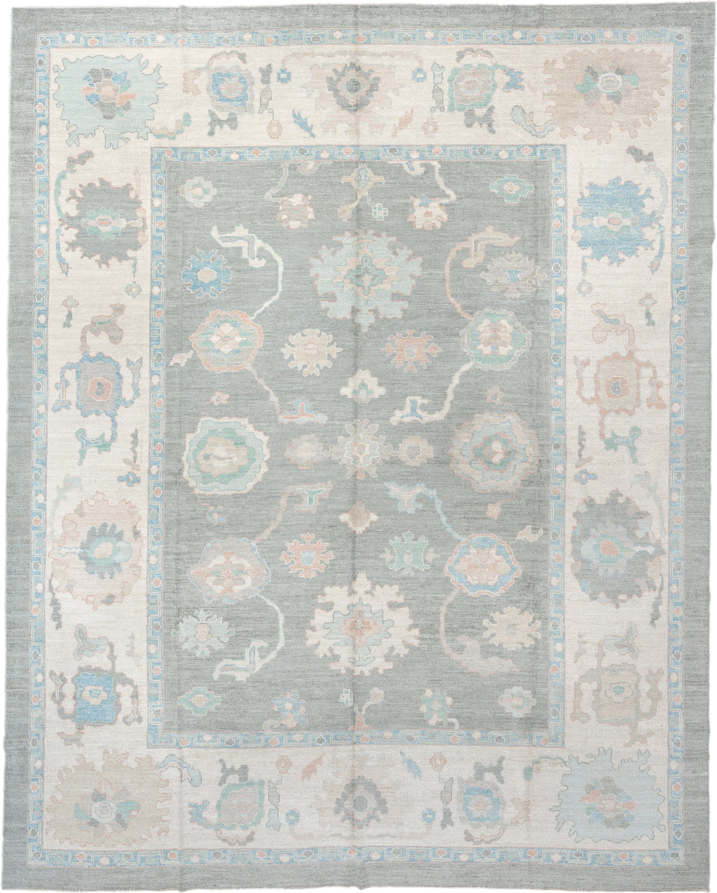 12' x 15' one-of-a-kind handmade vintage Oushak oversize rug. Color palette: pale blue, ivory, taupe, peach, sage, charcoal