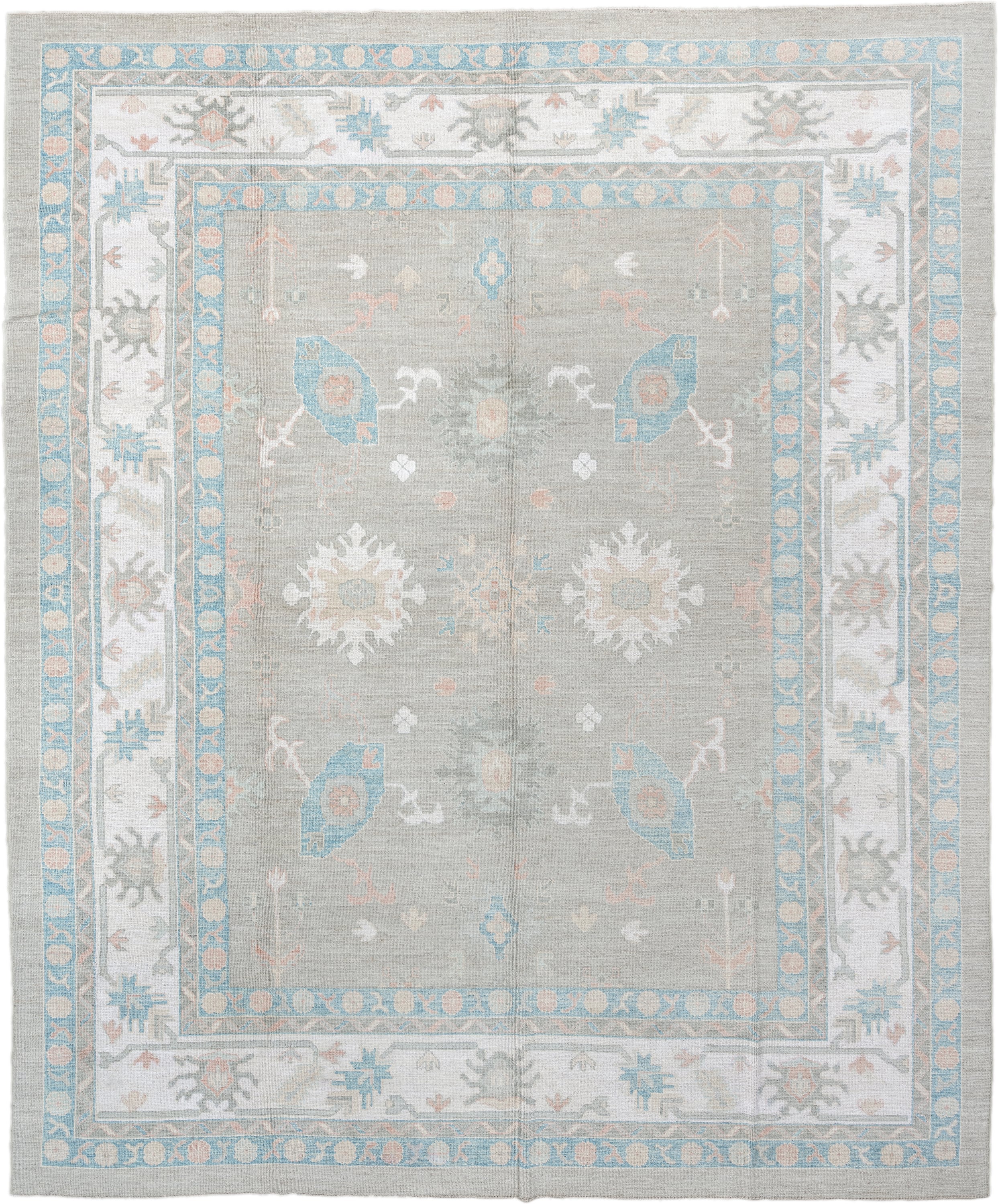 12' x 15' one-of-a-kind handmade vintage Oushak oversize rug. Color palette: pale gray, ivory, sky blue, peach, taupe, sage