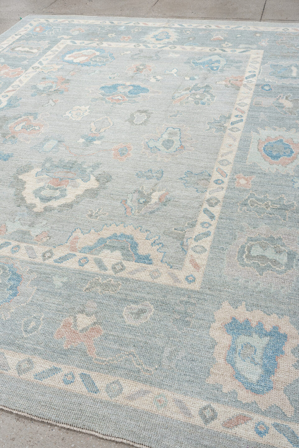8' x 10' one-of-a-kind handmade vintage Oushak large size rug. Color palette: pale blue, ivory, sky blue, blush, taupe