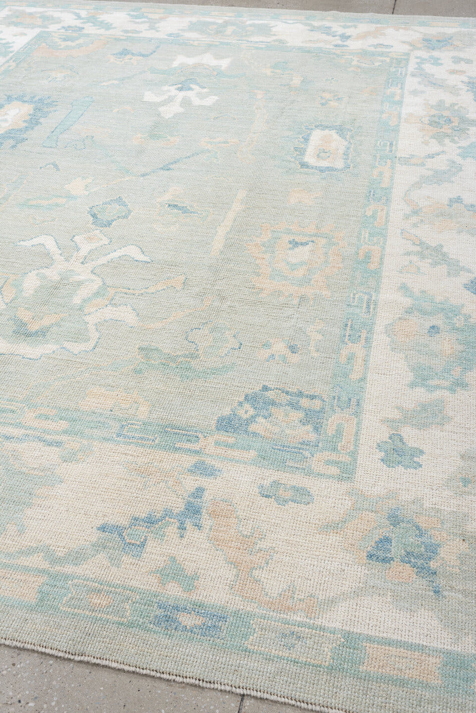 8' x 10' one-of-a-kind handmade vintage Oushak large size rug. Color palette: pale aqua, ivory, sky blue, taupe, cream, sage